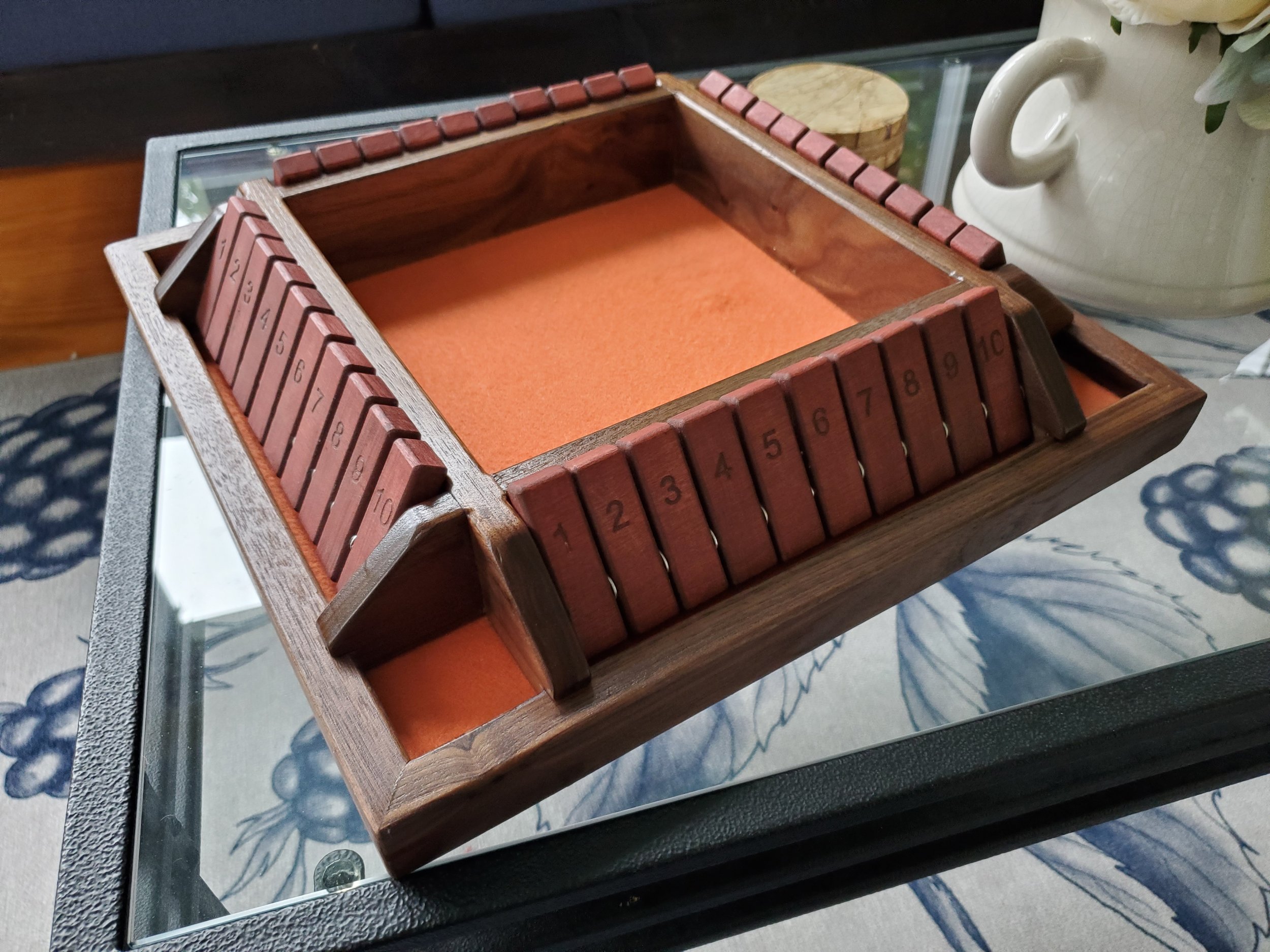 4-top Shut the Box in orange & maroon, made form walnut