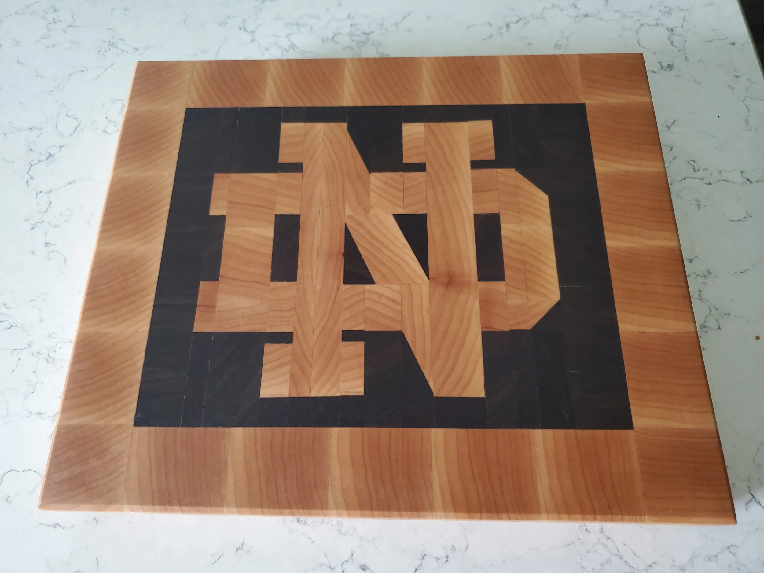 "Notre Dame" end-grain cutting board made from maple & walnut