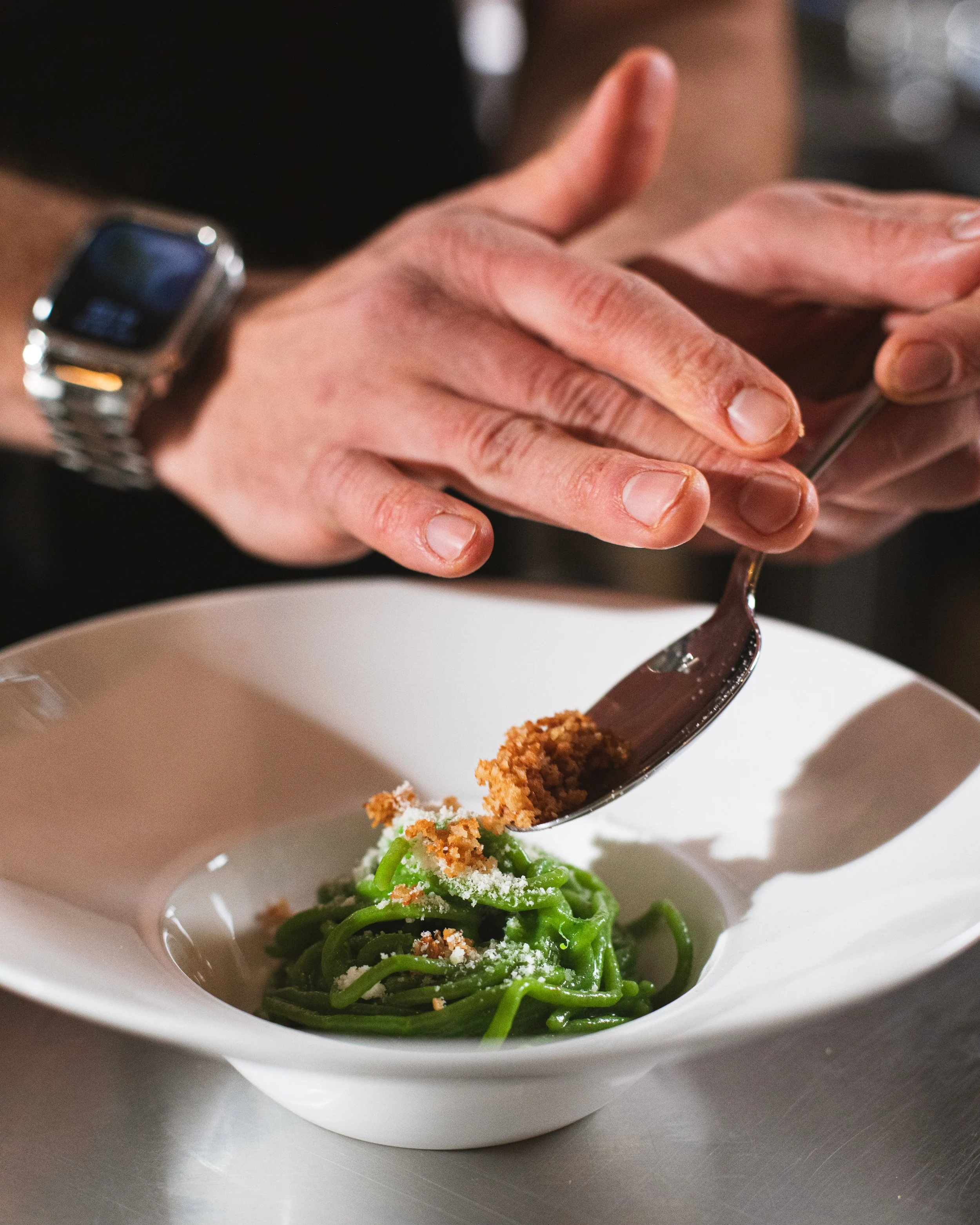 Cotto's Spaghetti Verde is our modern take on aglio e olio, featuring spinach infused spaghetti tossed with confit garlic, aleppo pepper, and vibrant herb oil. Simple, bright, and deeply flavorful.