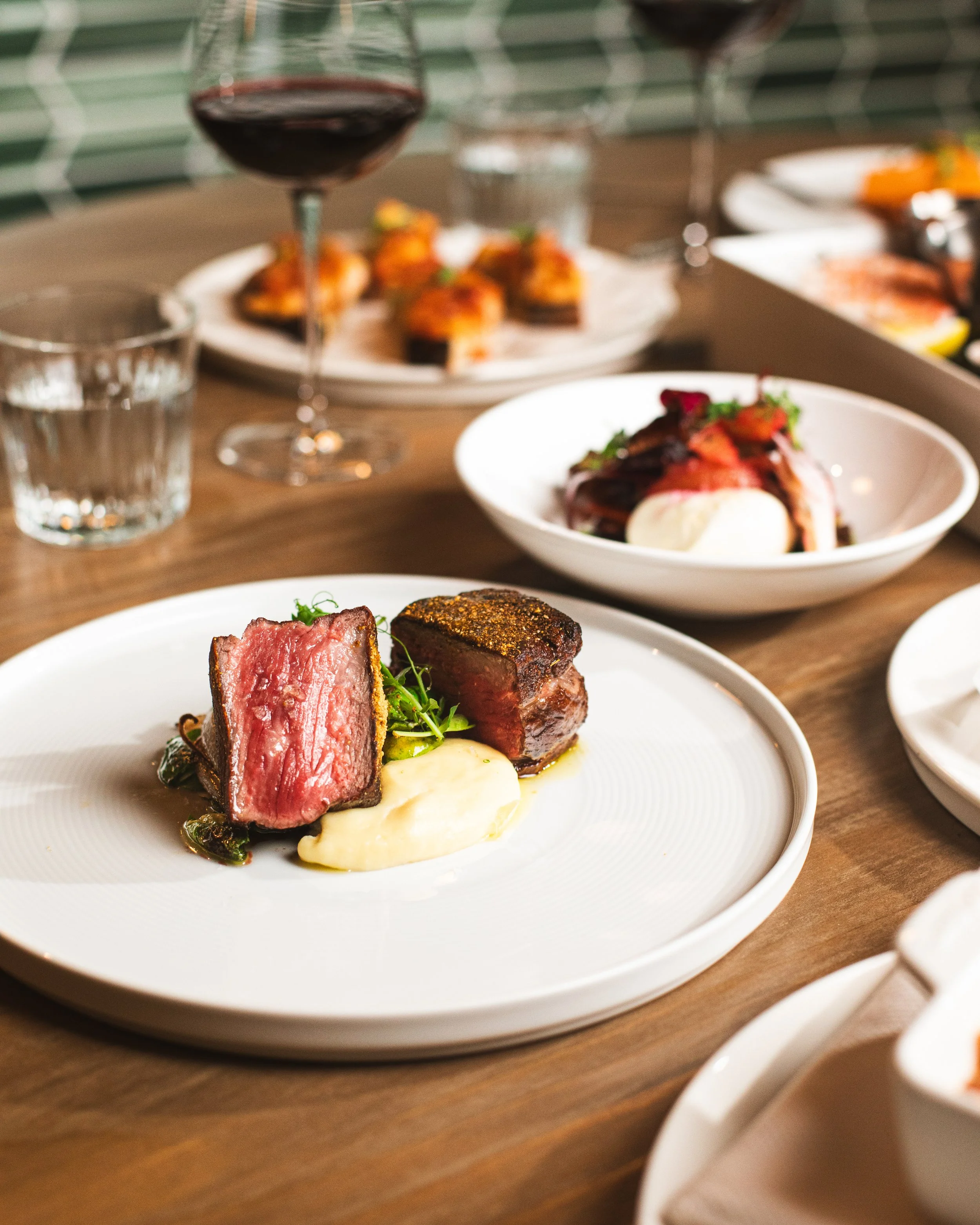 Cotto's NY Strip is a refined steakhouse classic, featuring perfectly cooked medallion of prime beef finished with parsnip butter, roasted Brussels sprouts, and caramelized onions. Rich, savory, and balanced.