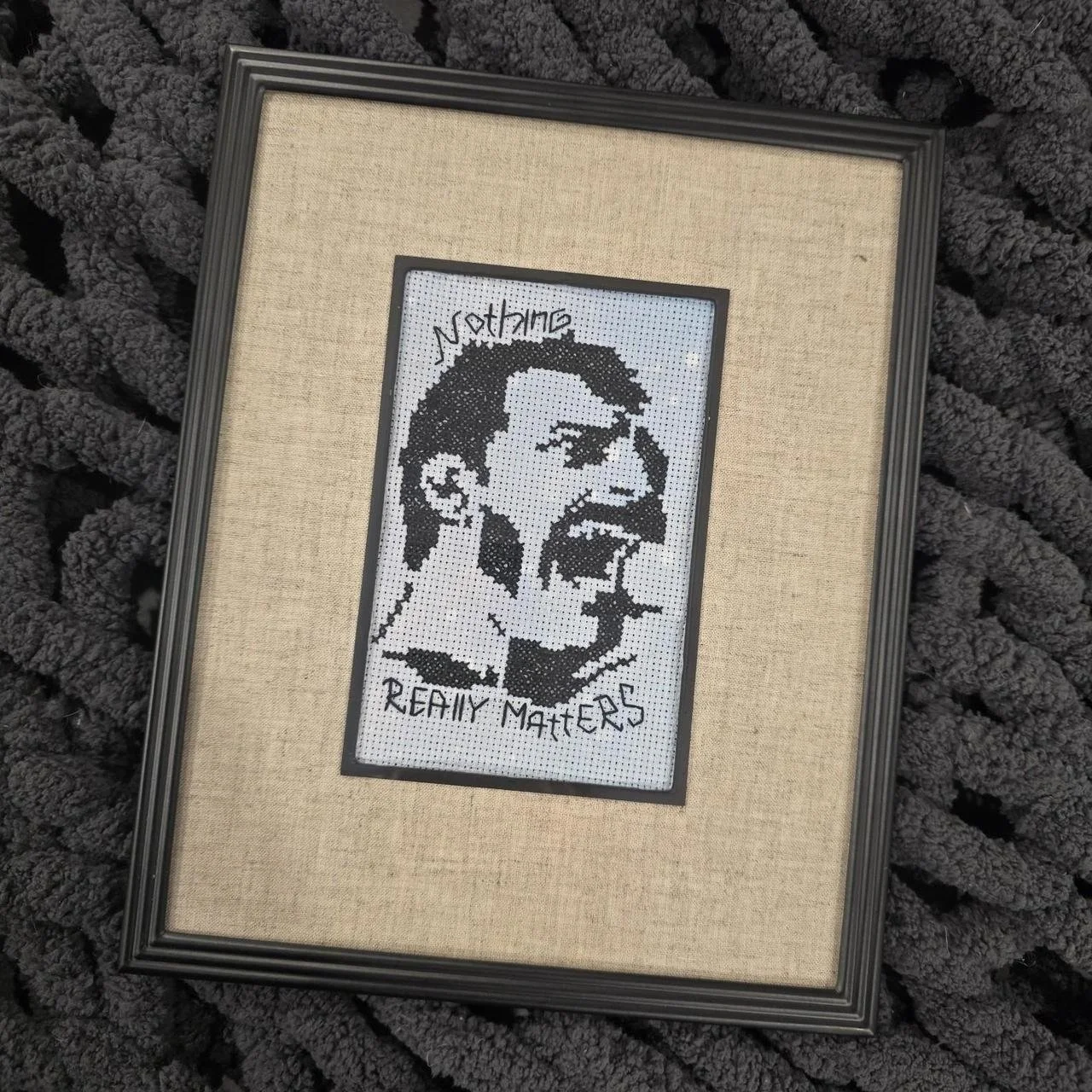 Framed cross stitch of Freddie Mercury