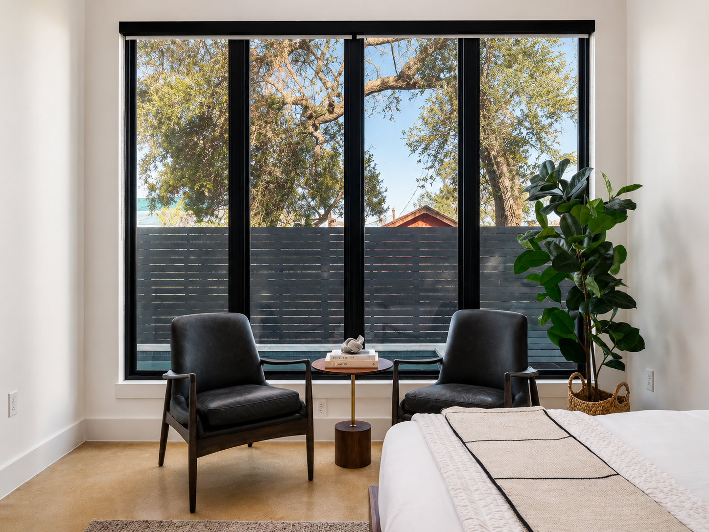 Anita St. minimalist reading nook with plants.png