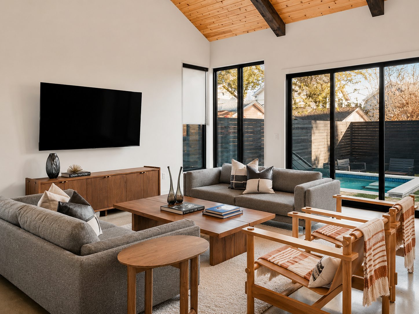 Anita St. minimalist living room with pool view.png