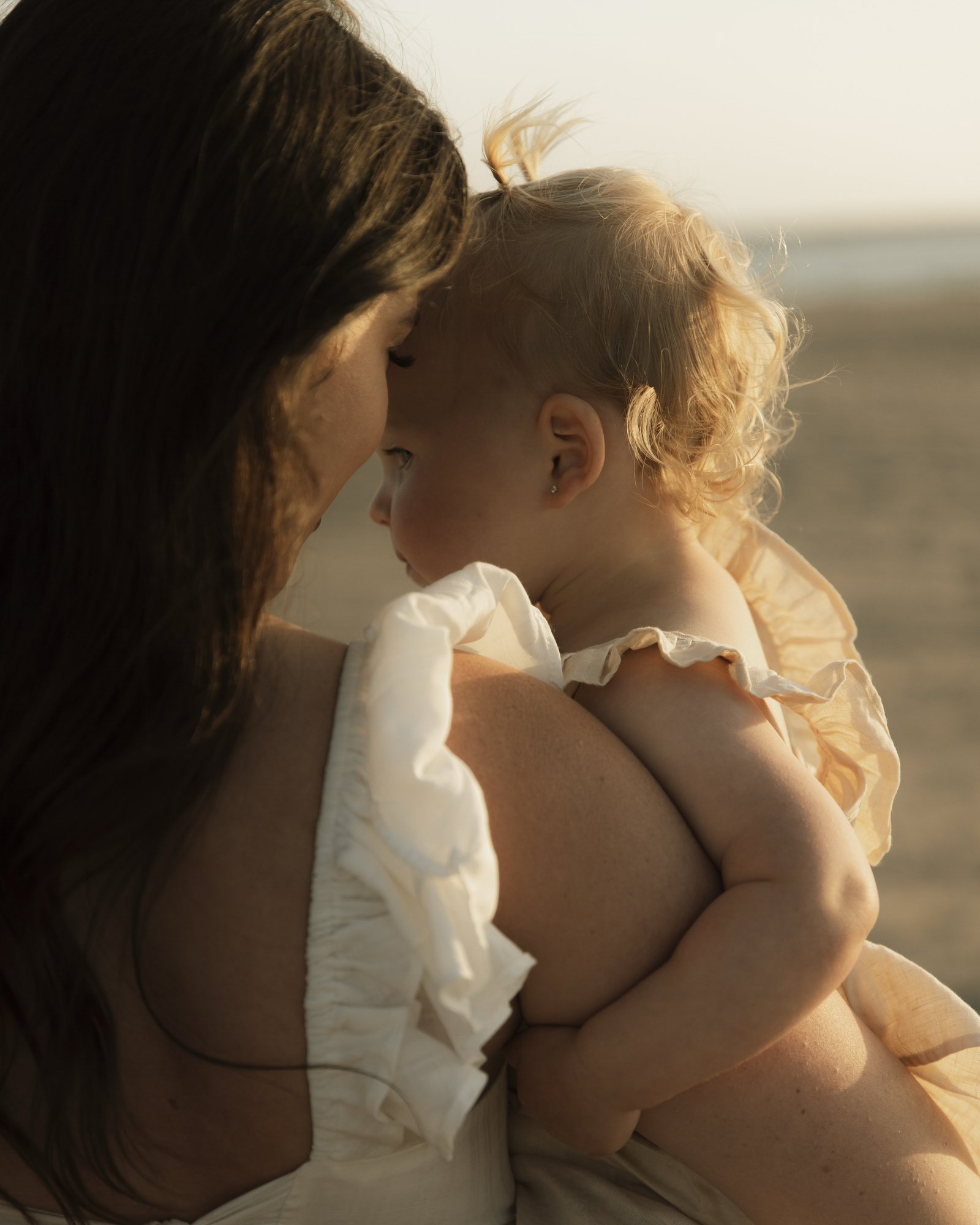 Los Angeles family photography focusing on close-up details and connection between mother and baby