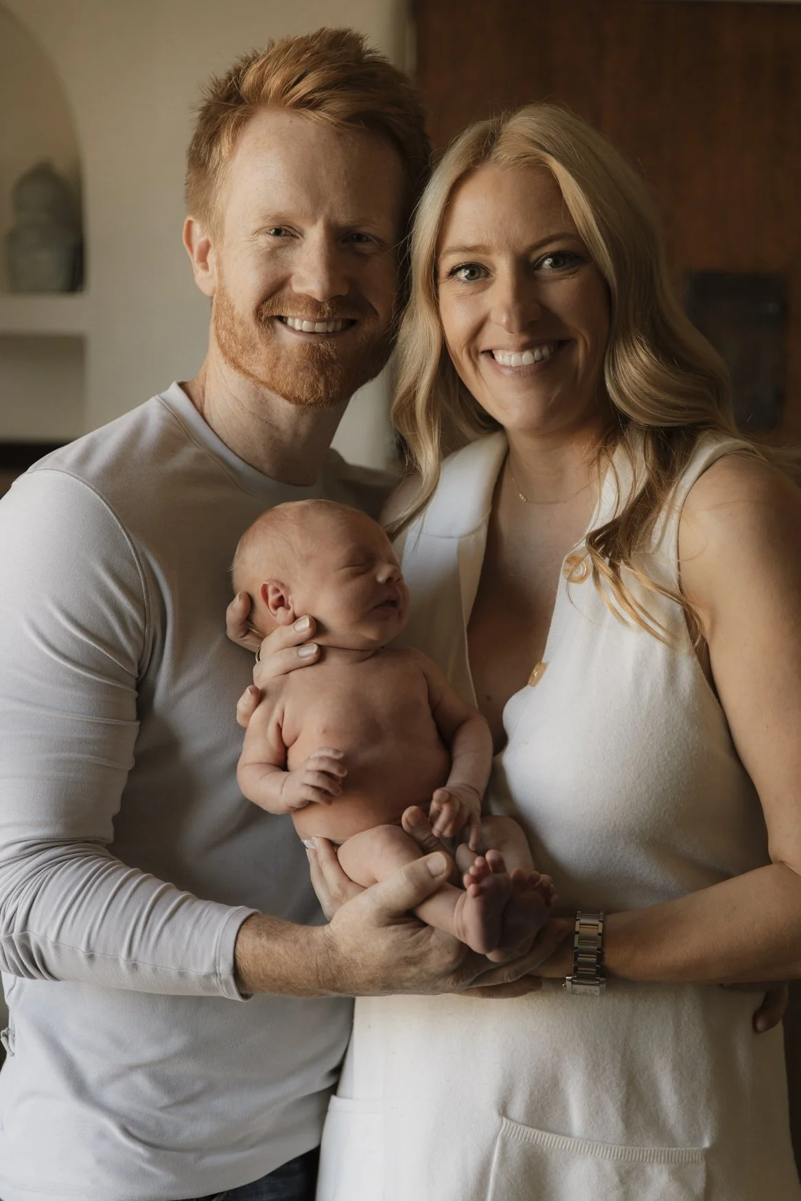 Los Angeles newborn photographer using natural light to capture a session in-home