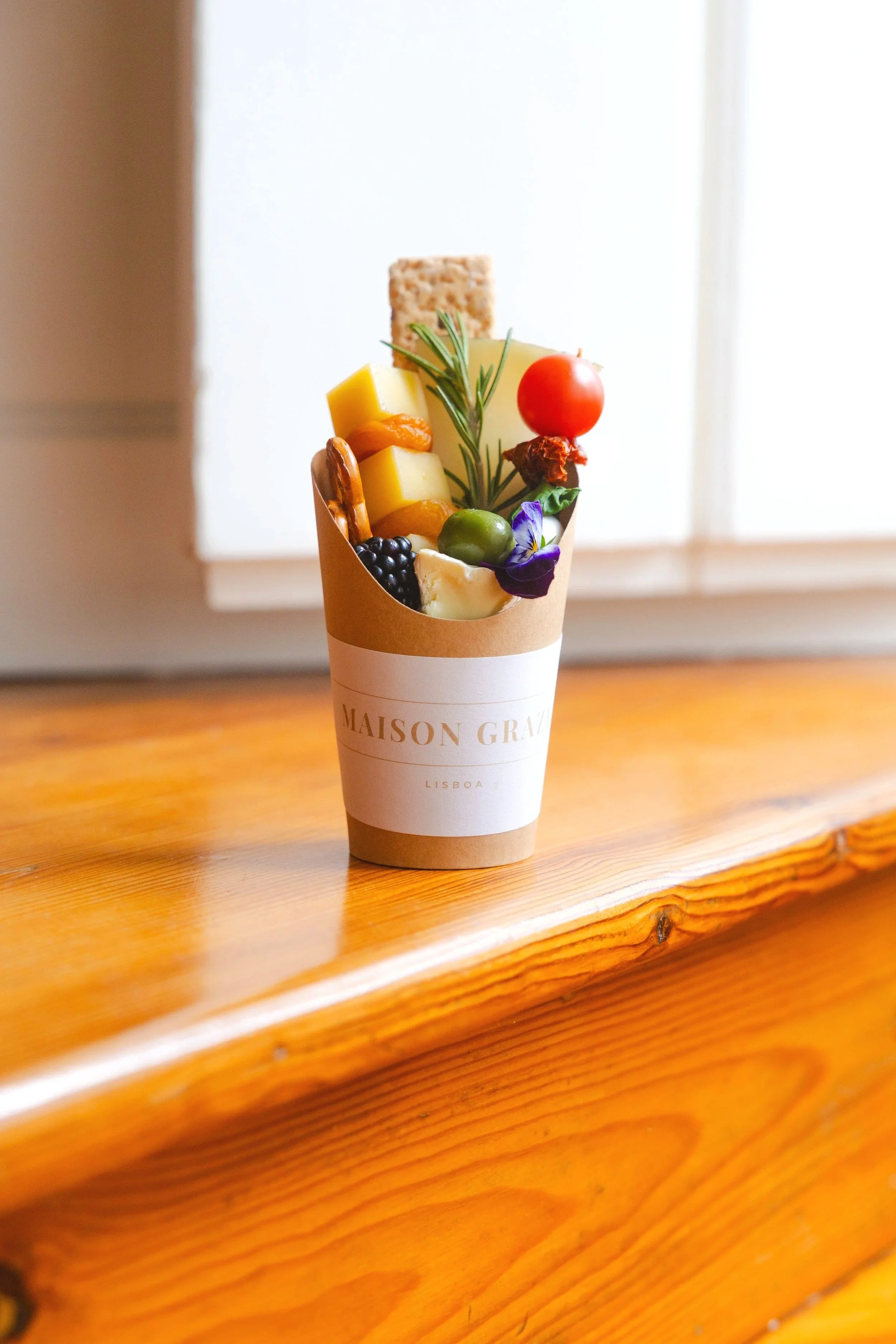 Artfully arranged grazing box with cheese, fruit and charcuterie