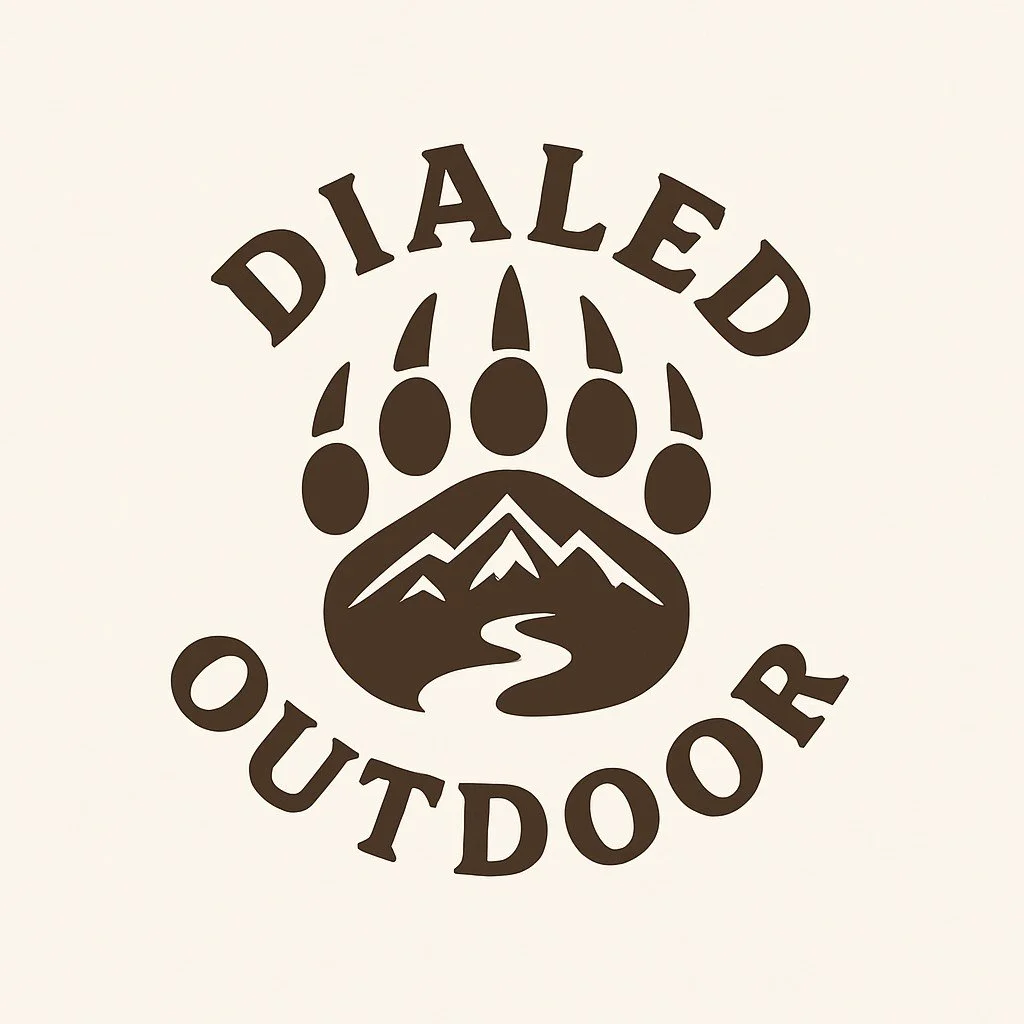 Logo for Dialed Outdoor featuring mountain range, valley, and a rain droplet with the words 'Dialed Outdoor' in bold.
