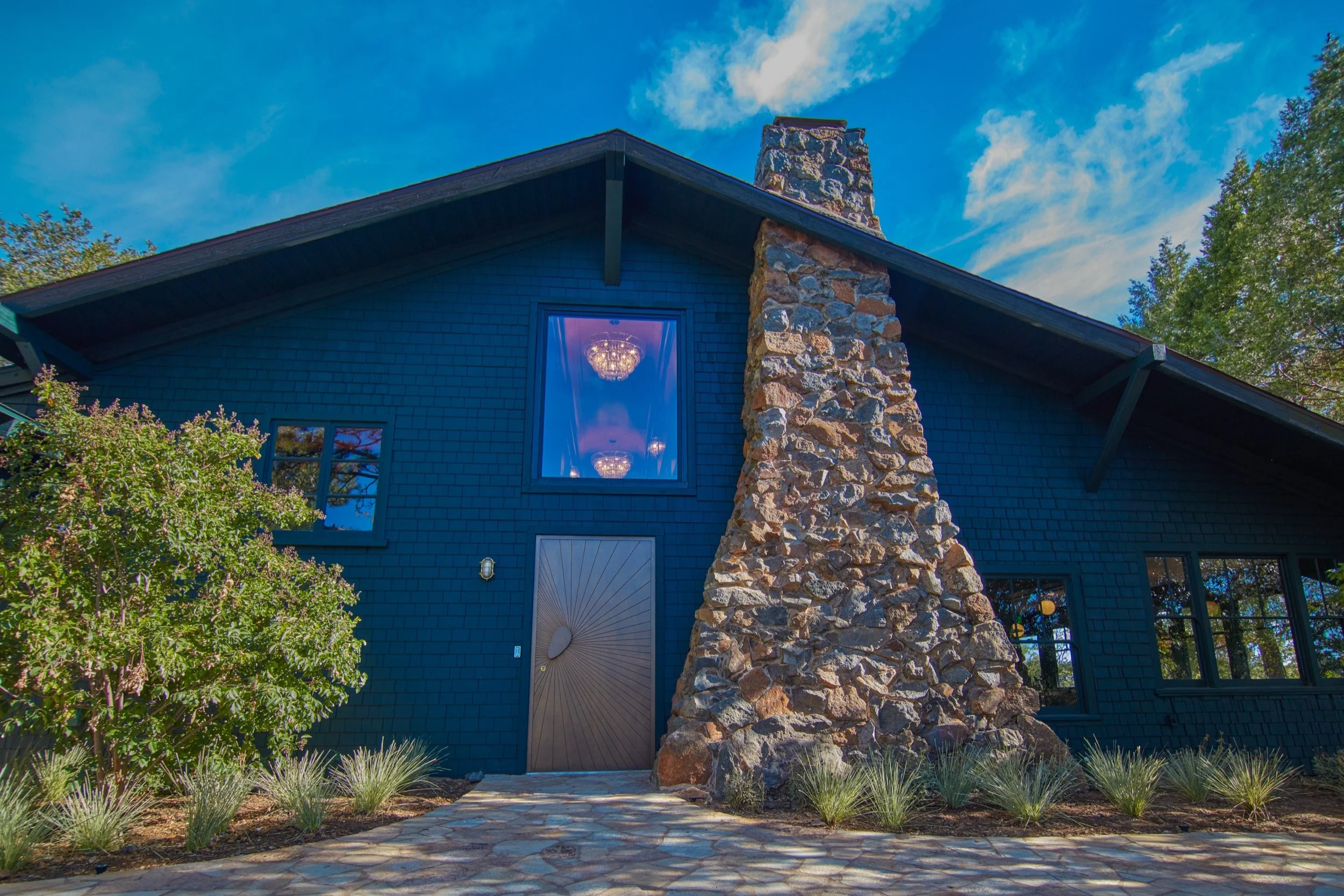 The Lodges's shingled exterior and native stone chimney.