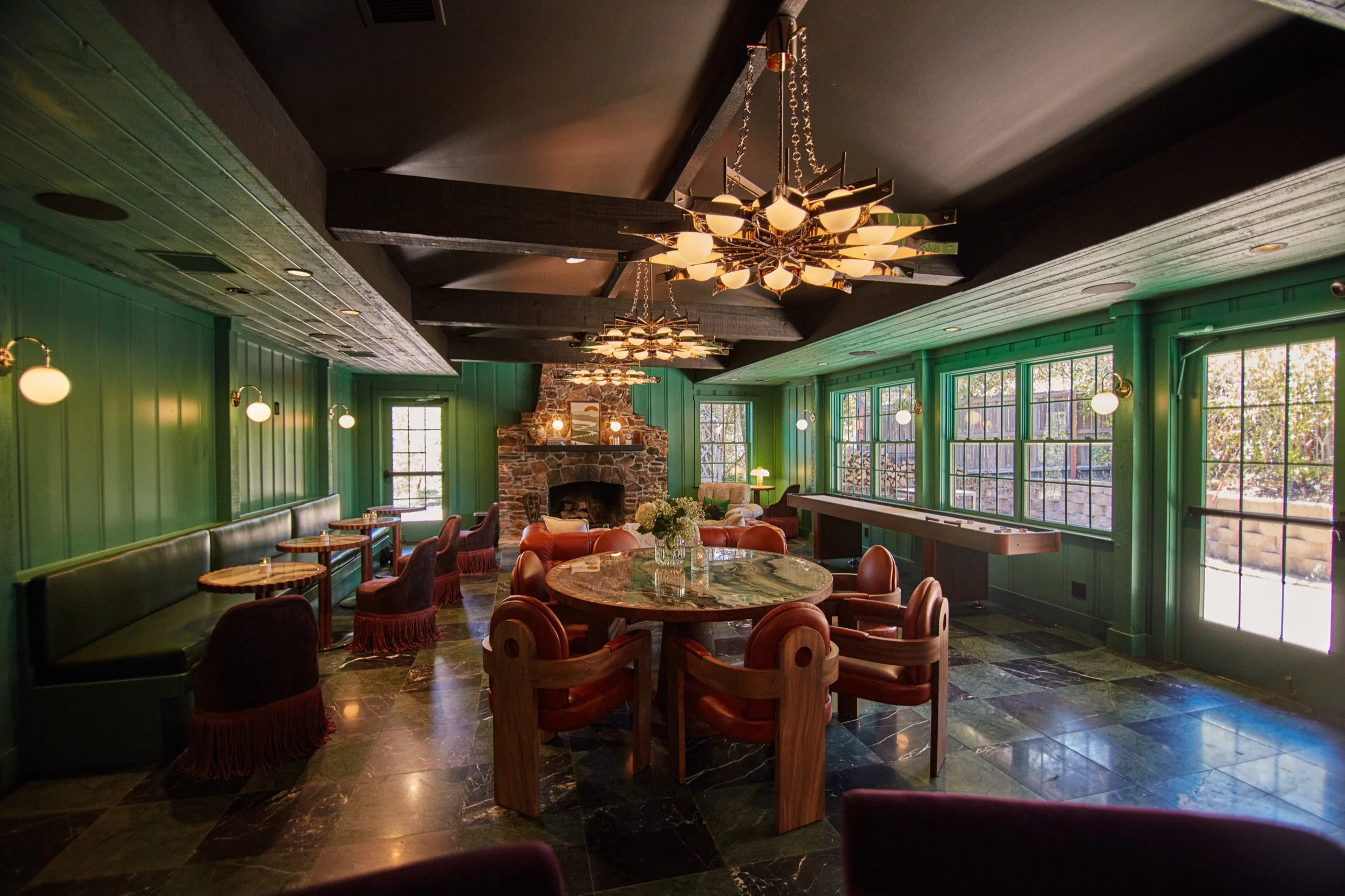 Another view of The Lodge Bar's green-walled lounge area.