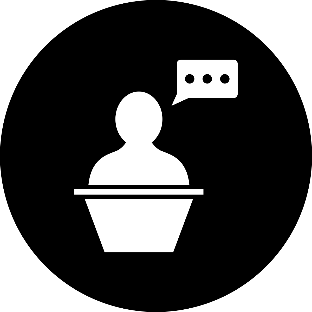 Silhouette of a person at a podium with a speech bubble containing three dots.