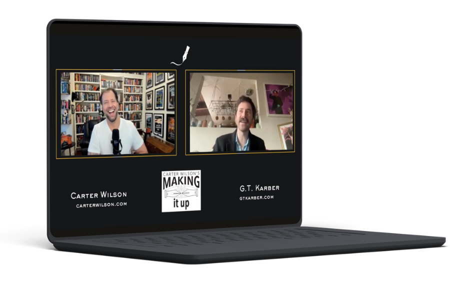 A laptop displaying a virtual interview or podcast with two men, one in a room with a bookcase and framed pictures, and the other in a room with art on the wall. The screen has logos for 'Carter Wilson's Making it Up' and the names Carter Wilson and G.T. Karber with their websites.