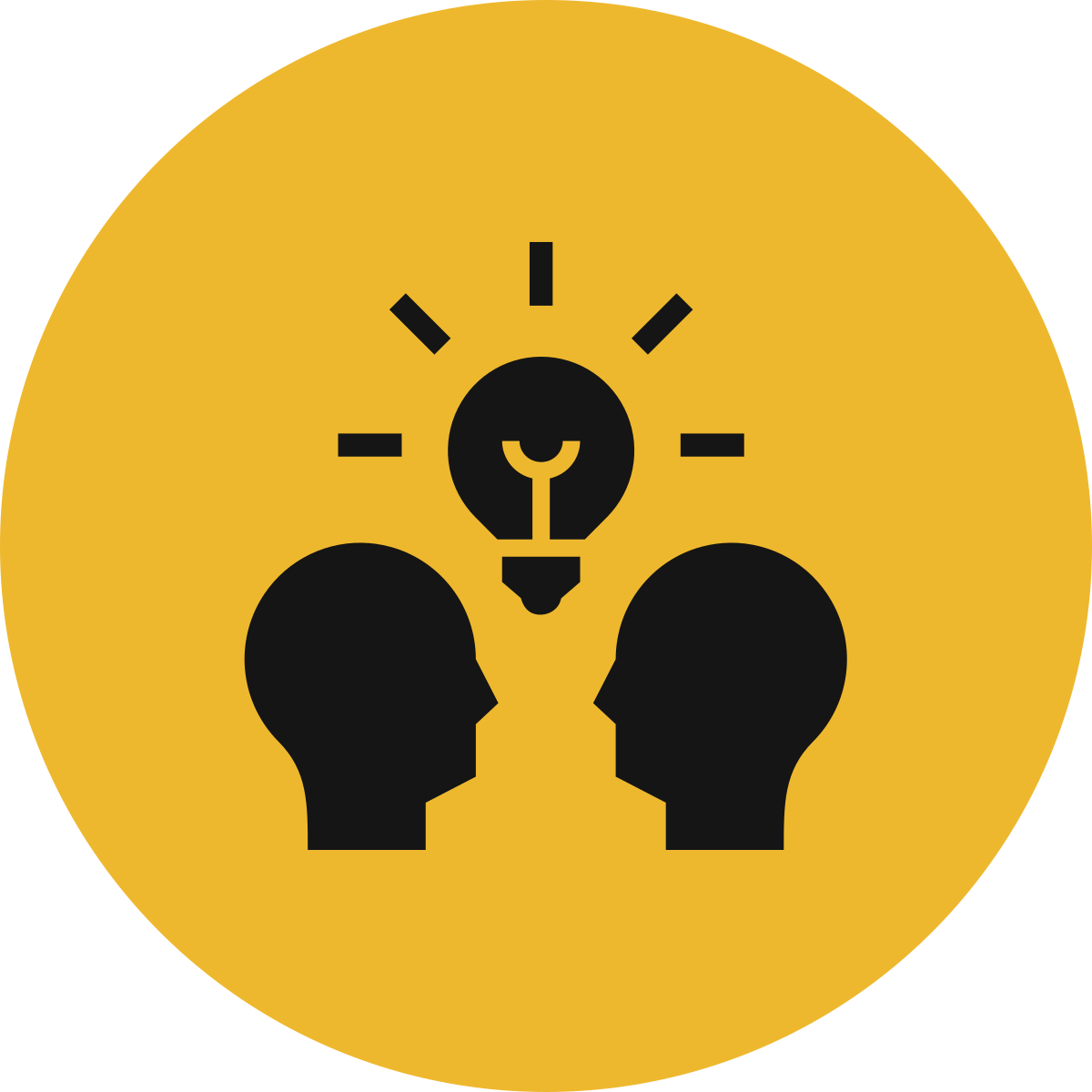 Silhouettes of two human heads facing each other with a light bulb above them, symbolizing ideas or discussion, all on a yellow circular background.