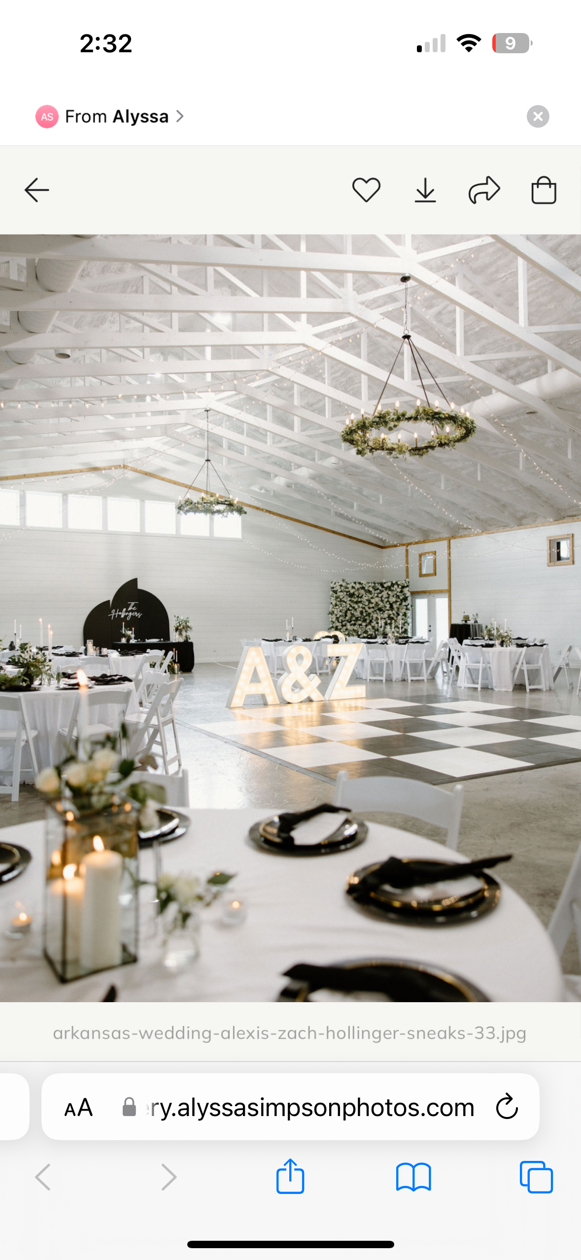 Elegant wedding reception hall decorated with white tables, black and gold plates, candles, and floral centerpieces. Large illuminated initials 'A & Z' on the dance floor. Overhead chandeliers and string lights add to the festive atmosphere.