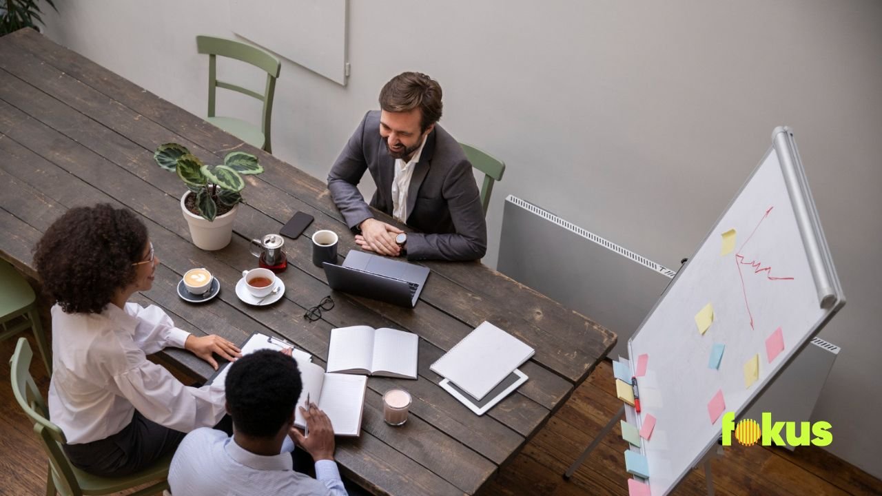 image of a office meeting talking about learning and development strategy with business goals