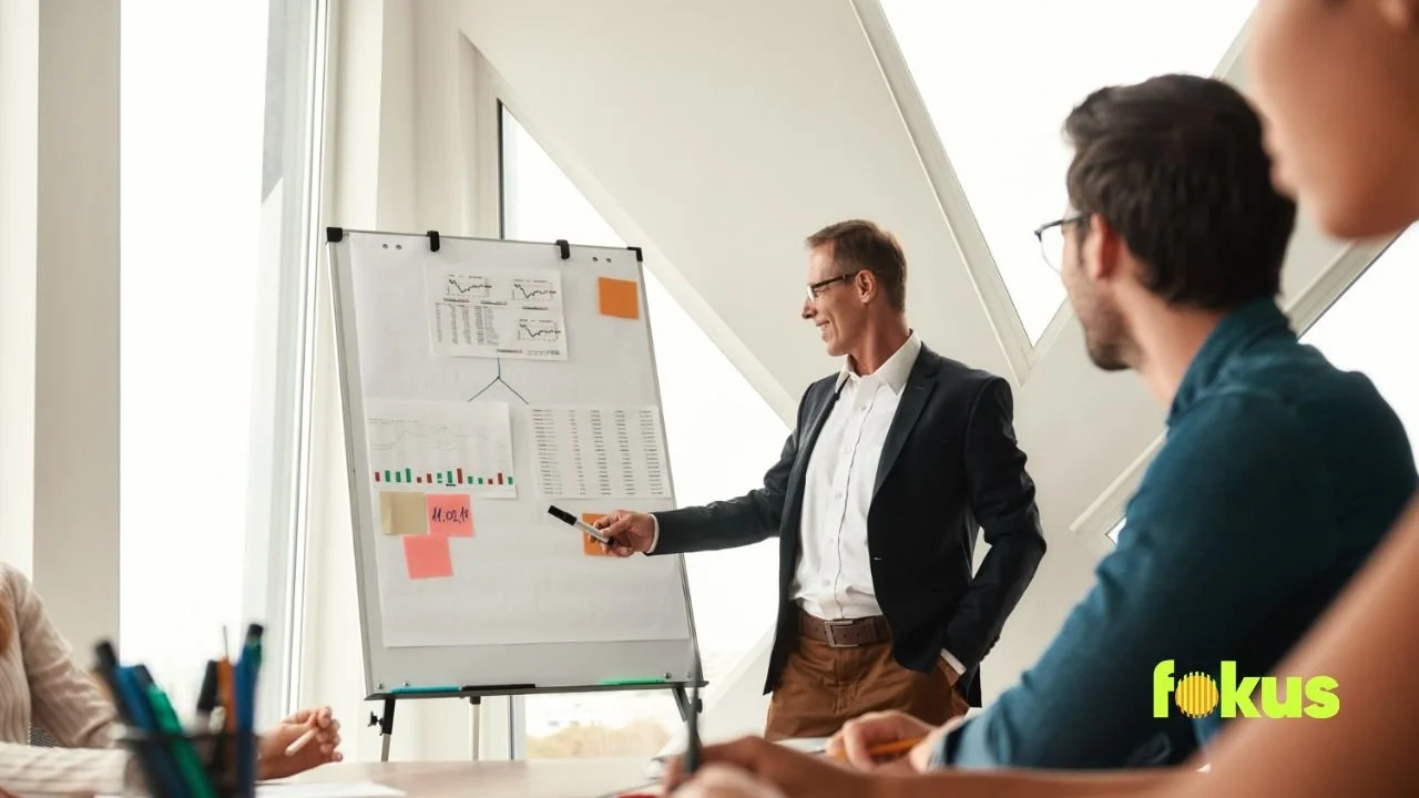 A man presents to an audience on the topic of instructional design in training.
