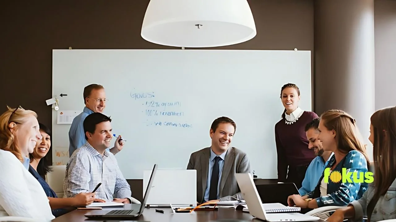 image of a group to people talking about required tranings for employees