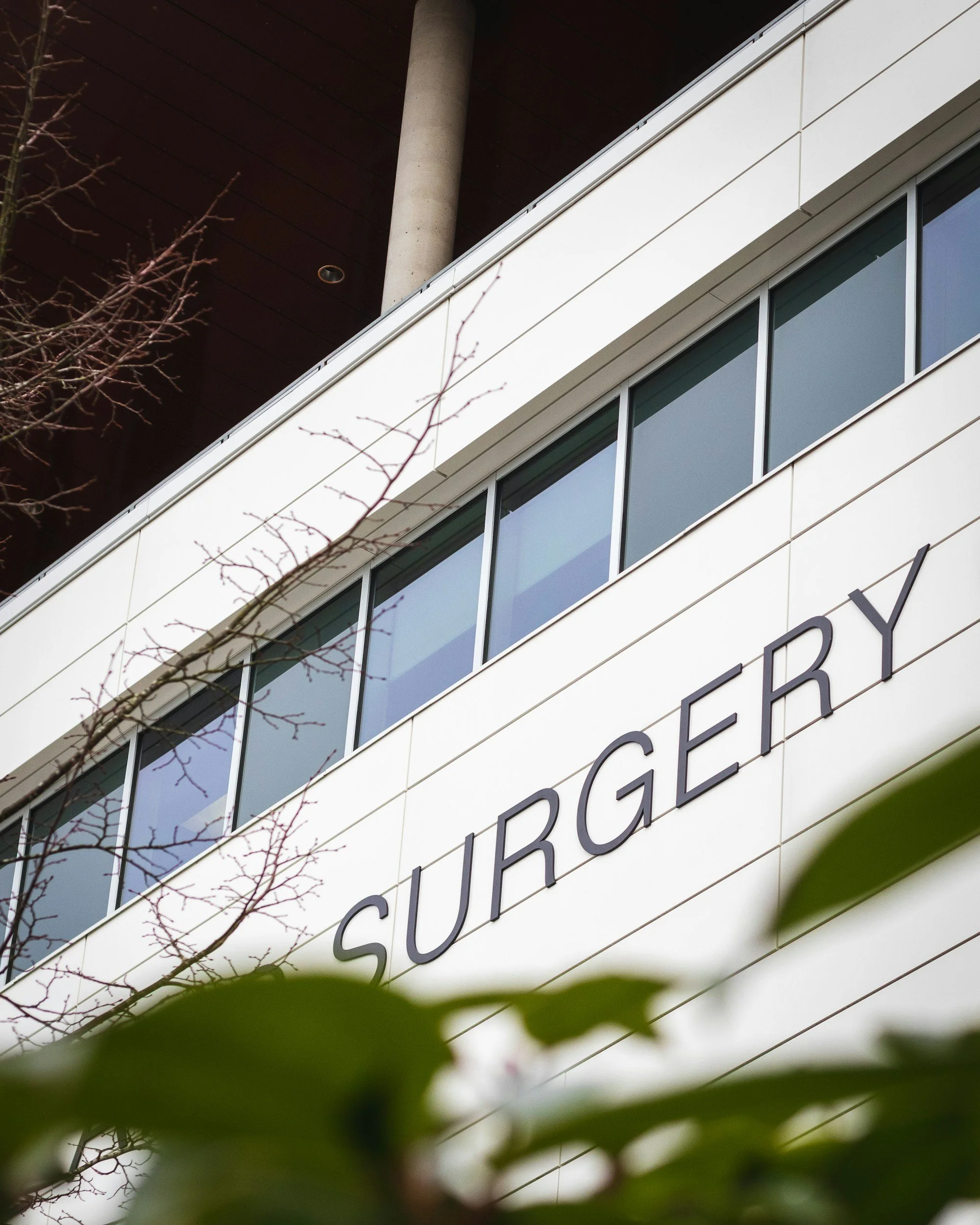 side of hospital building that says "surgery"