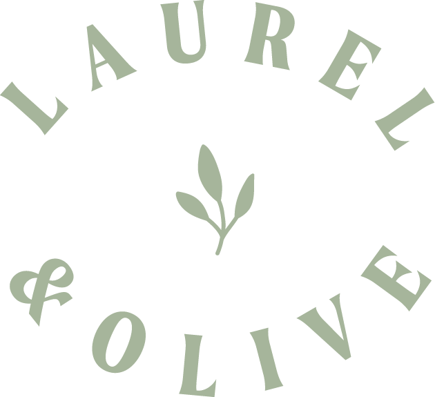 A logo with the words 'LAUREL & OLIVE' in a circular arrangement around a small branch with leaves in the center.