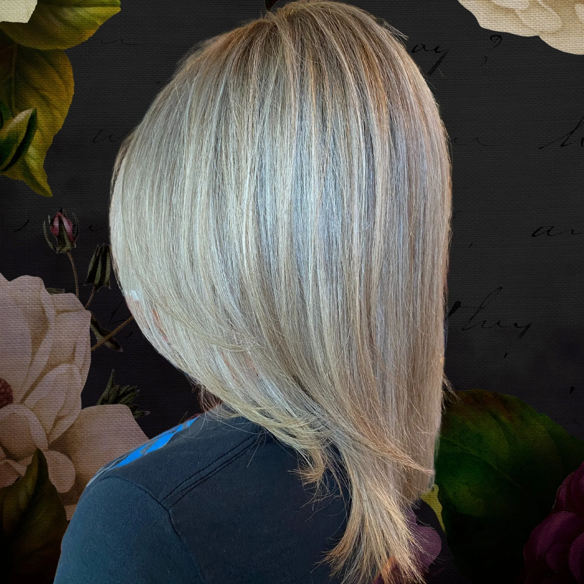 A close-up shows crimped blonde hair, styled into a sleek, voluminous shape that cascades down the back Revampt Hair Doylestown PA.jpg