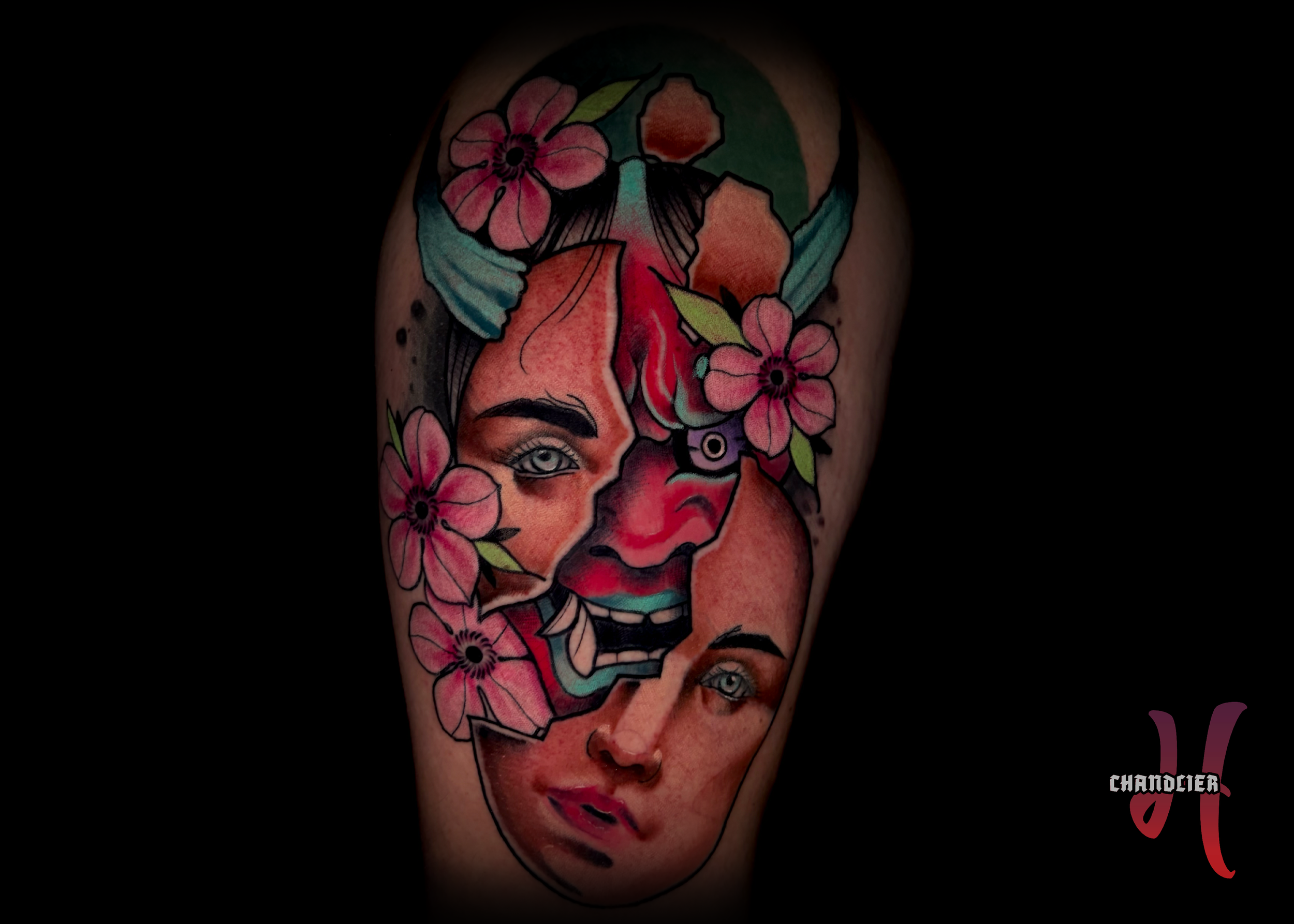 A Chandlier Harford tattoo of a broken reversed Hannya mask human face with demon underneath.
