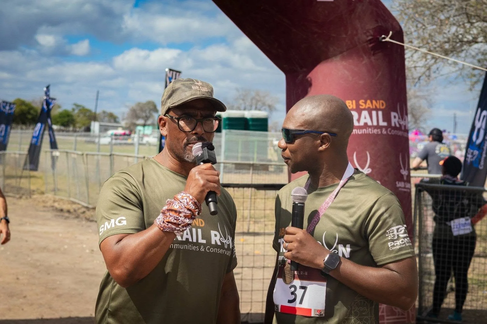 James Mayinga holds a microphone at the Sabi Sabi Trail Run
