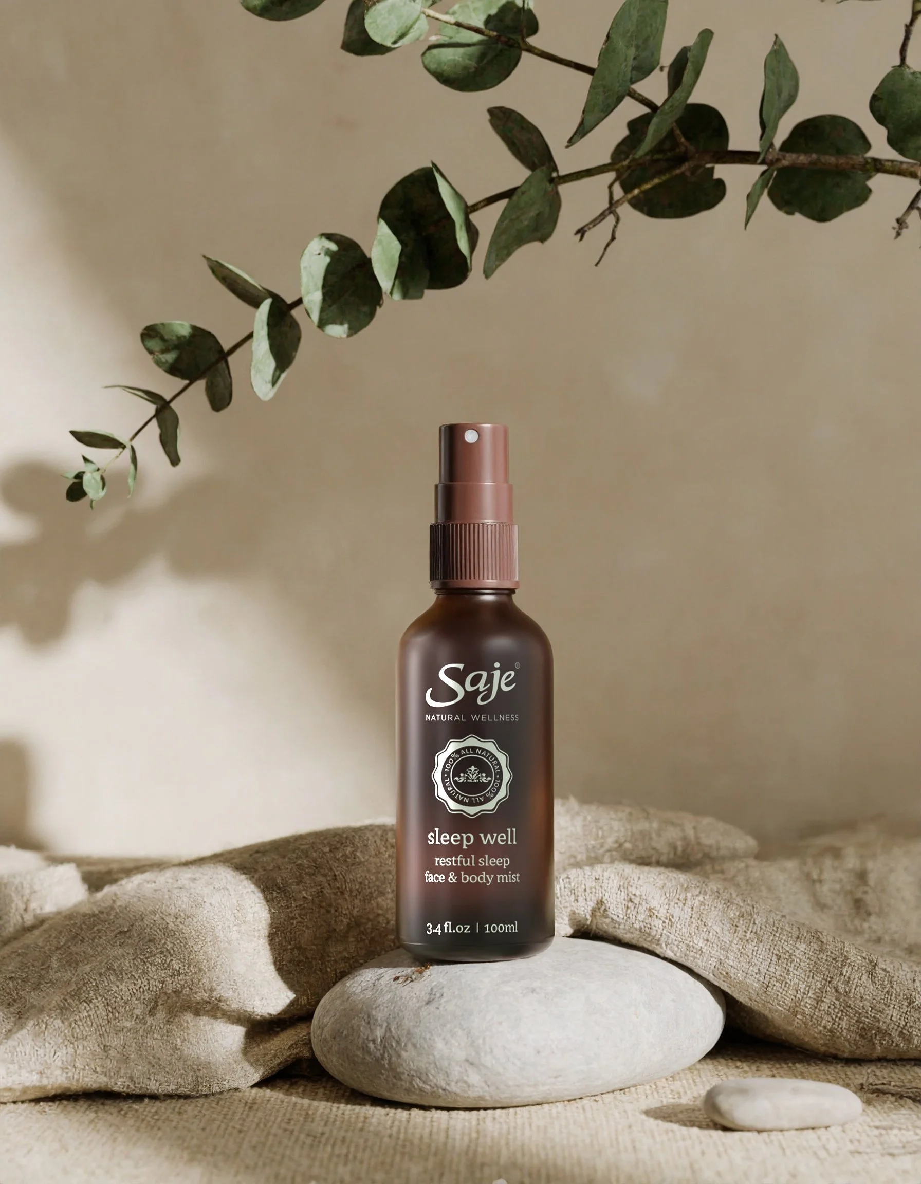 1Firefly_Product bottle centered, eucalyptus leaves branching out, smooth stones, linen cloth, 178722.jpg