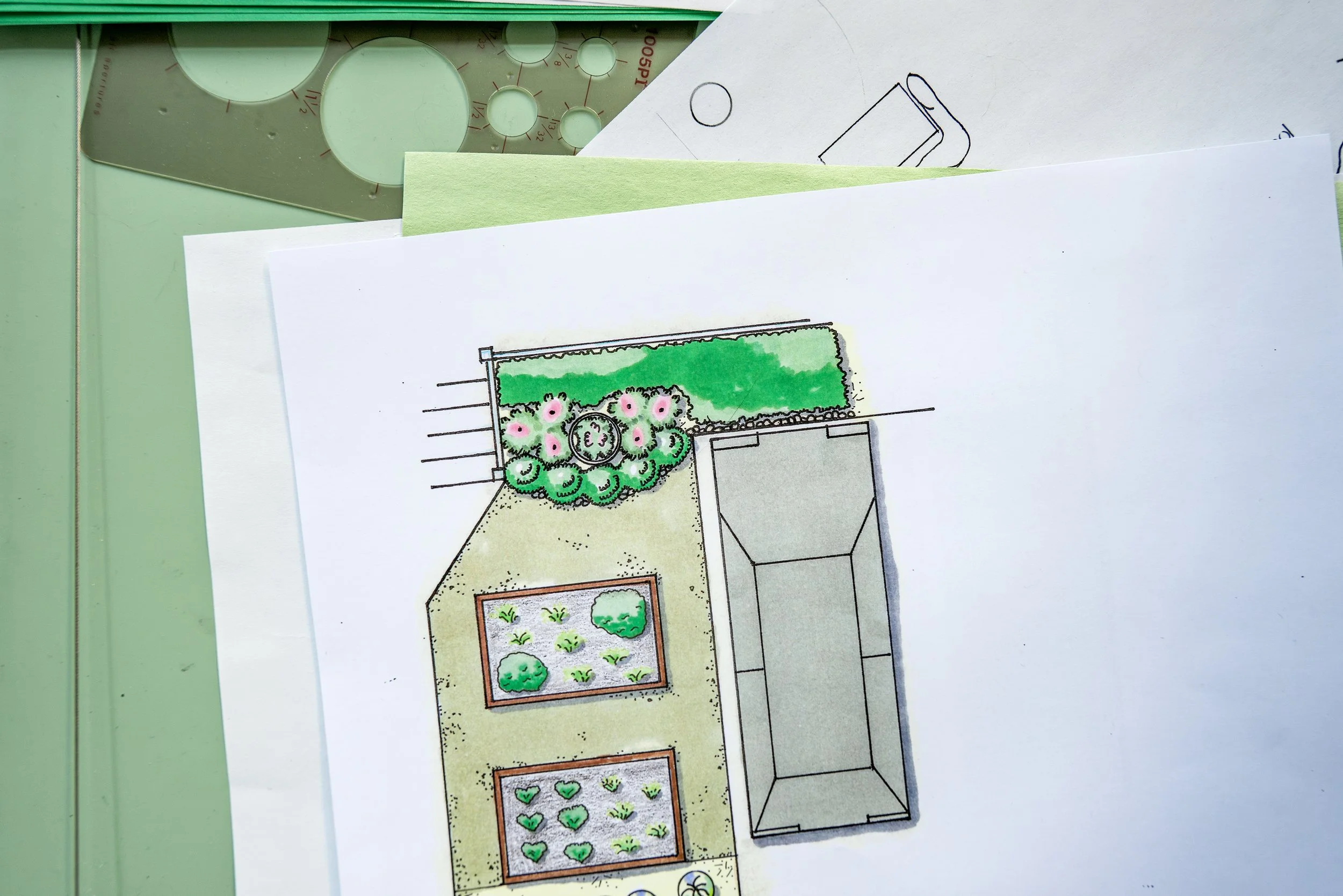 An architectural sketch of a backyard garden, showing various plants and flowers in designated garden beds, a lawn area, and surrounding outdoor features.