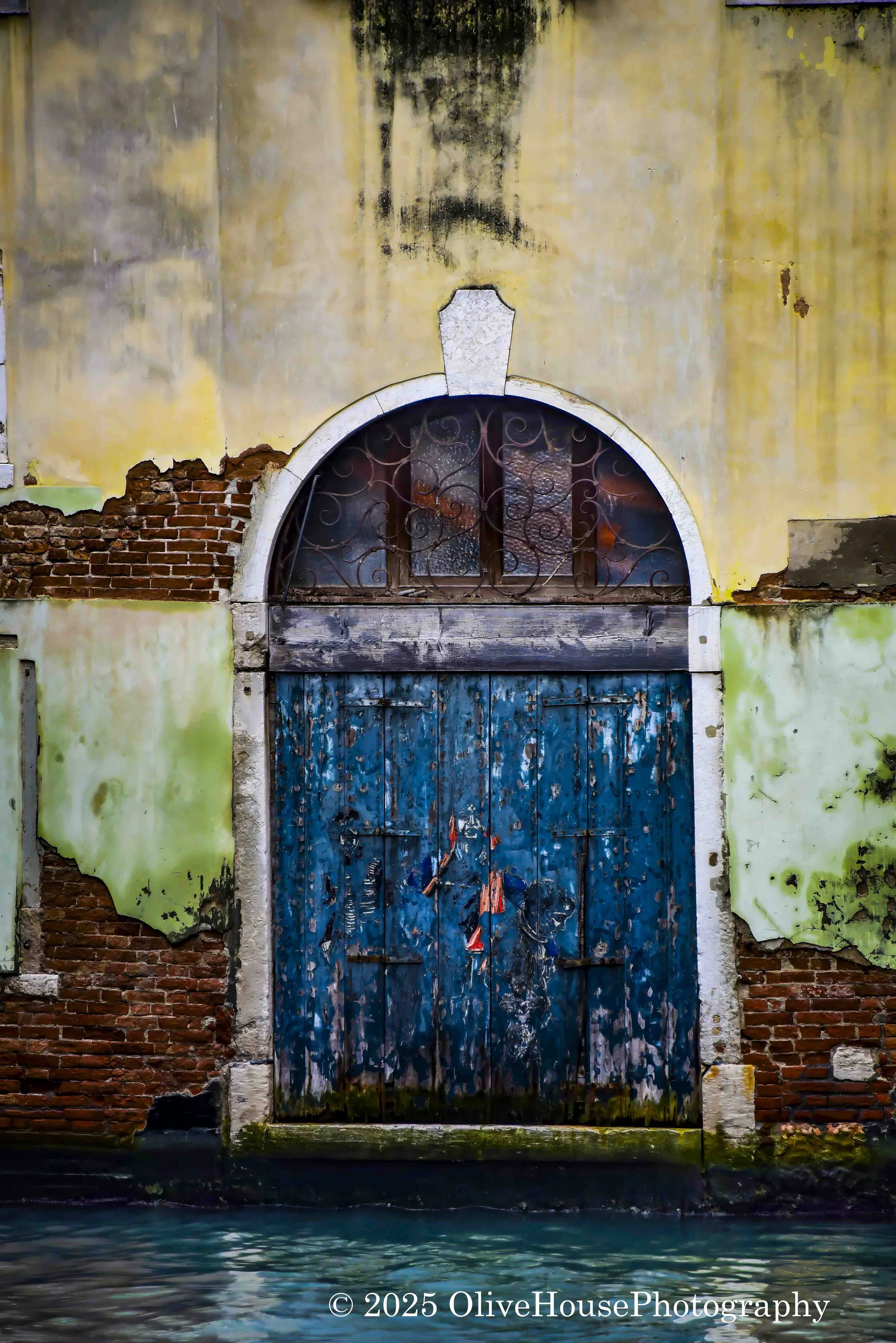 Historic blue door in Venice, Italy, one of the most photographed doors in the city.