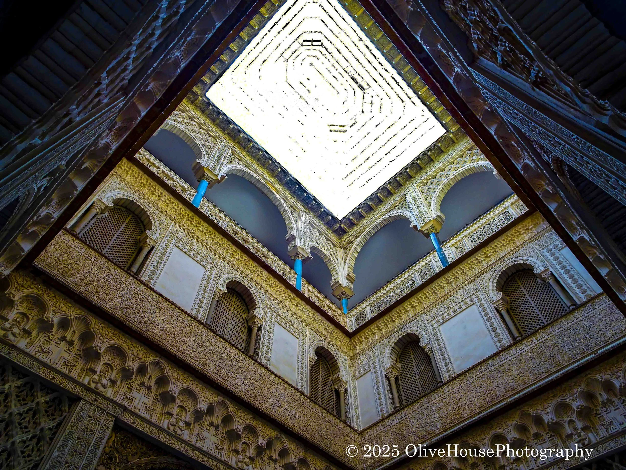 Photo of the interior courtyard of the Alcázar of Seville, Spain