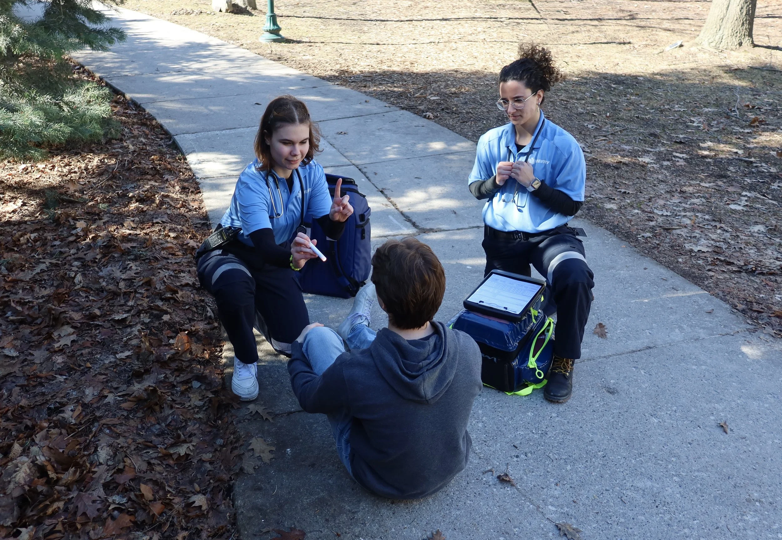 Two female Aventry Medical medics treating a male patient