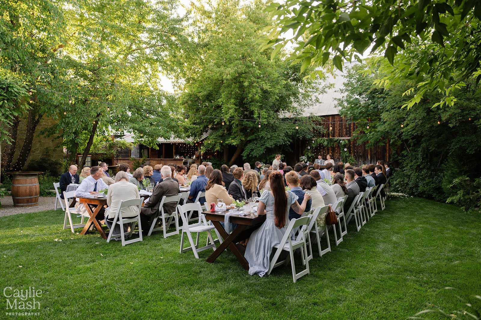 An image of guests at an outdoor wedding at StoneHouse101. StoneHouse101 is an intimate indoor outdoor events venue in Roslyn, Washington, hosting weddings, birthdays, anniversaries, and more near Cle Elum, WA.