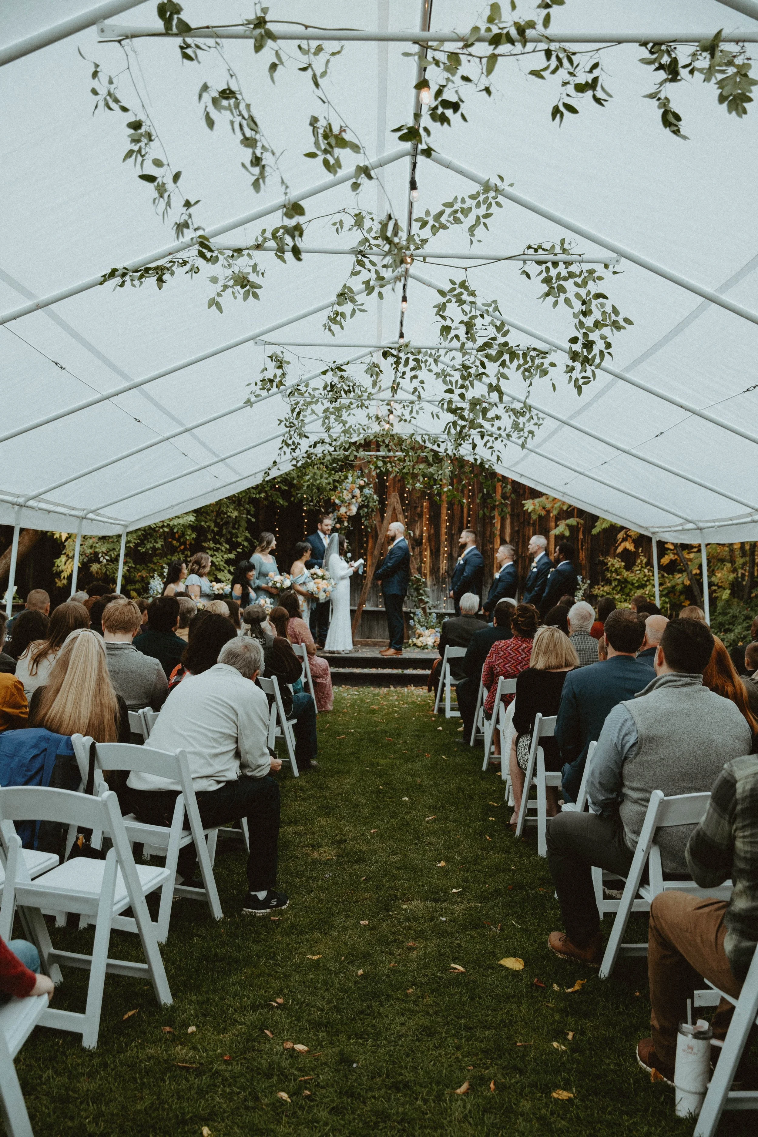 An image of an outdoor wedding during the fall at StoneHouse101. StoneHouse101 is an intimate indoor outdoor events venue in Roslyn, Washington, hosting weddings, birthdays, anniversaries, and more near Cle Elum, WA.