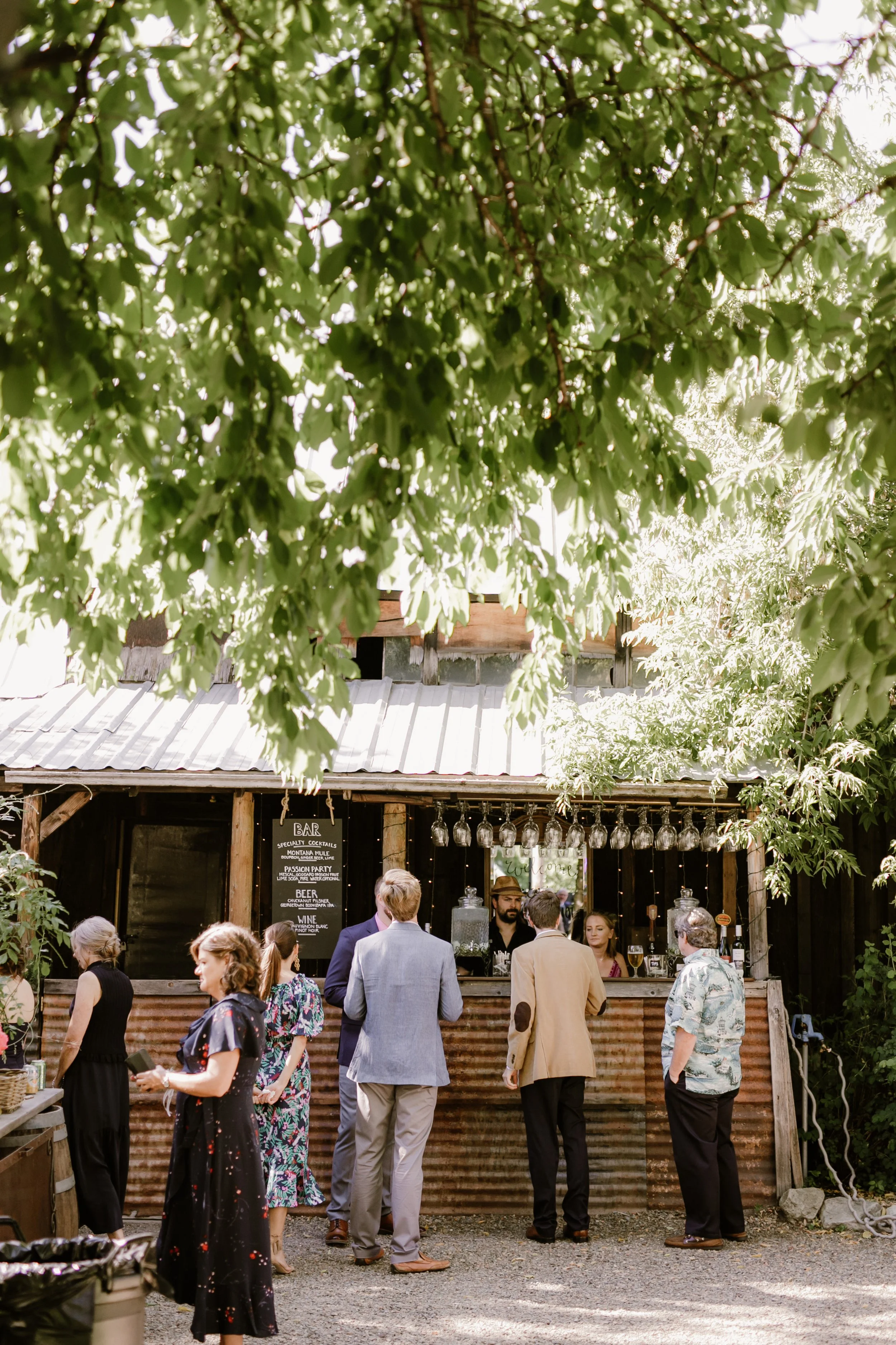 An image of guests at the bar at StoneHouse101. StoneHouse101 is an intimate indoor outdoor events venue in Roslyn, Washington, hosting weddings, birthdays, anniversaries, and more near Cle Elum, WA.