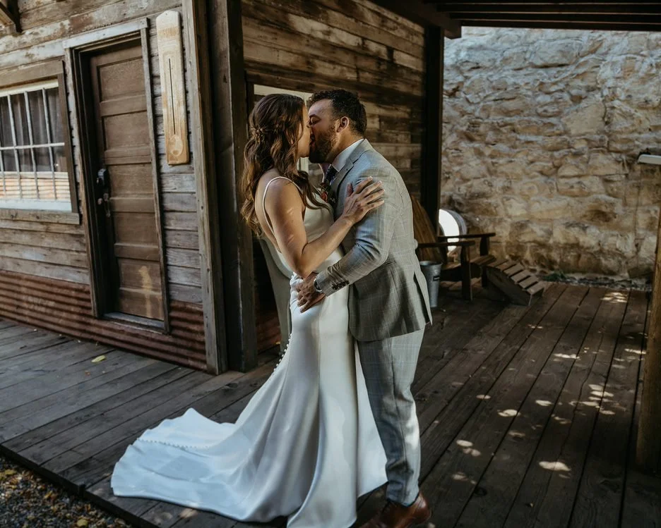 An image of a bride and groom at the historic StoneHouse101. StoneHouse101 is an intimate indoor outdoor events venue in Roslyn, Washington, hosting weddings, birthdays, anniversaries, and more near Cle Elum, WA.