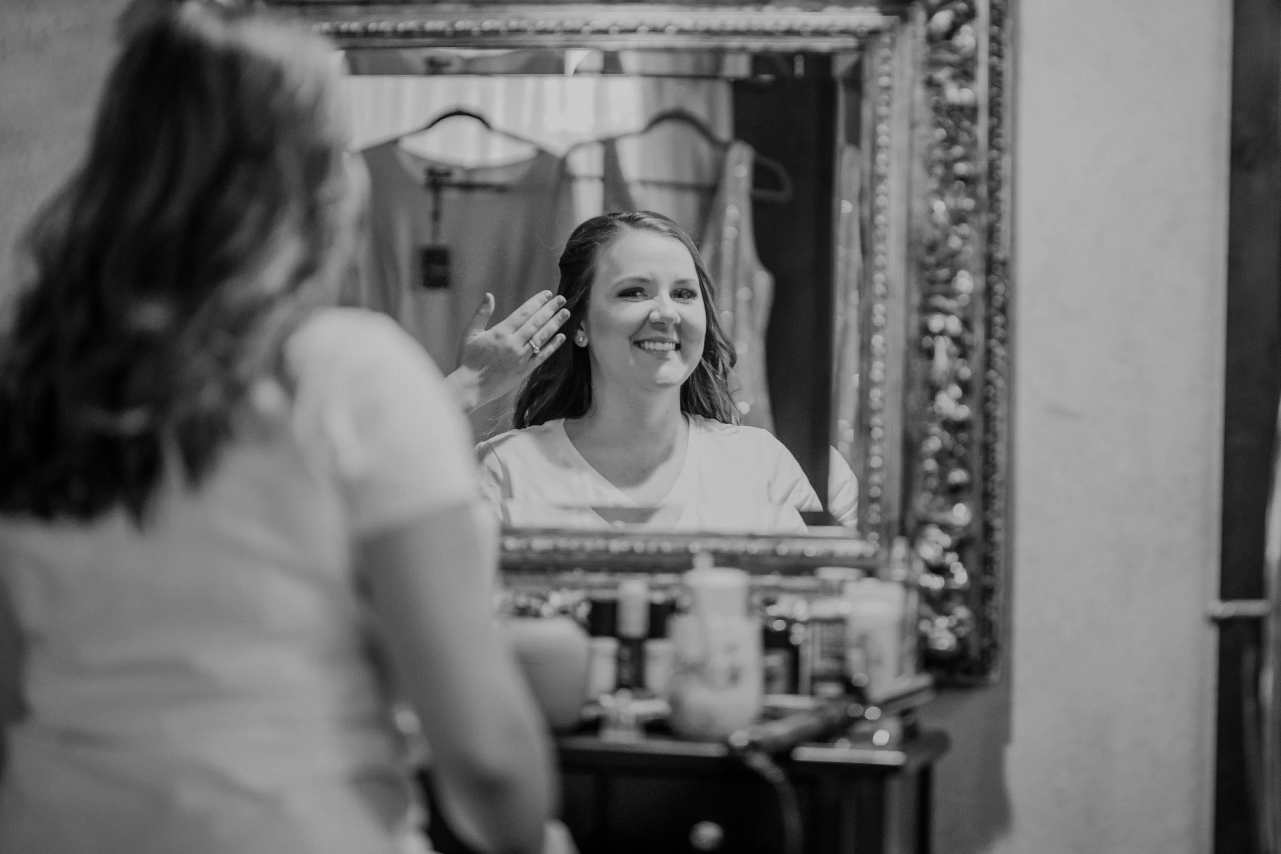 An image of a bride getting ready in StoneHouse101's bridal suite. StoneHouse101 is an intimate indoor outdoor events venue in Roslyn, Washington, hosting weddings, birthdays, anniversaries, and more near Cle Elum, WA.