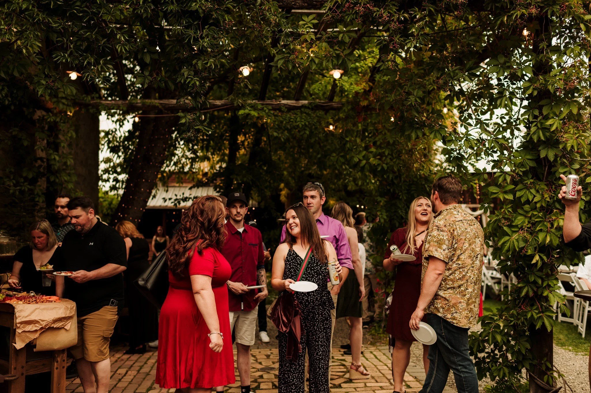 An image of guest smiling at an outdoor event at StoneHouse101. StoneHouse101 is an intimate indoor outdoor events venue in Roslyn, Washington, hosting weddings, birthdays, anniversaries, and more near Cle Elum, WA.