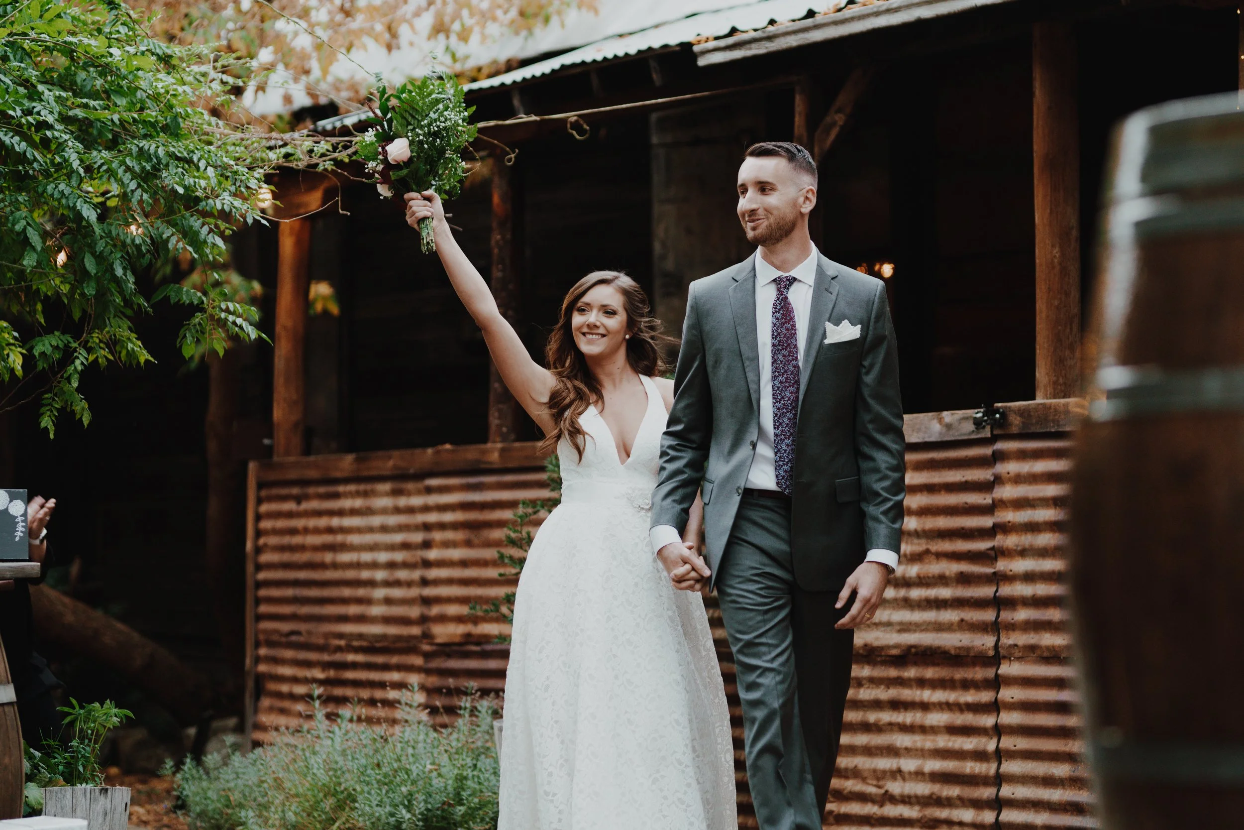 An image of a bride and groom entering their wedding reception in Roslyn, WA. StoneHouse101 is an intimate indoor outdoor events venue in Roslyn, Washington, hosting weddings, birthdays, anniversaries, and more near Cle Elum, WA.