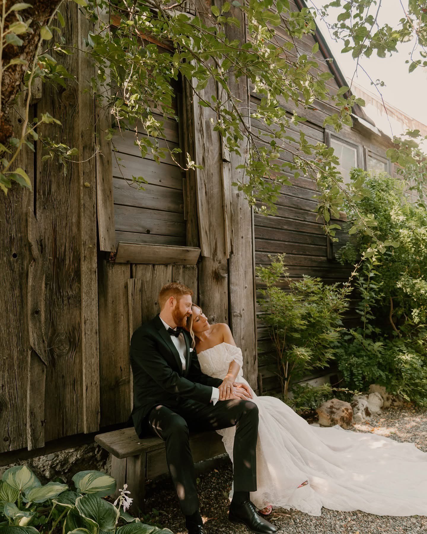 An image of a bride and groom smiling and posing at StoneHouse101. StoneHouse101 is an intimate indoor outdoor events venue in Roslyn, Washington, hosting weddings, birthdays, anniversaries, and more near Cle Elum, WA.