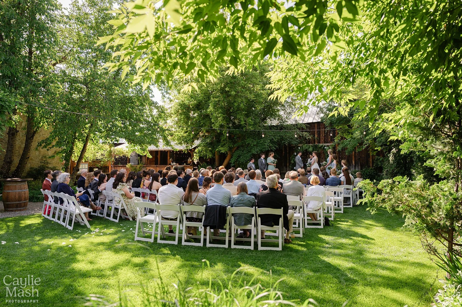 An image of an outdoor wedding ceremony at StoneHouse101 Events Venue. StoneHouse101 is an intimate indoor outdoor events venue in Roslyn, Washington, hosting weddings, birthdays, anniversaries, and more near Cle Elum, WA.