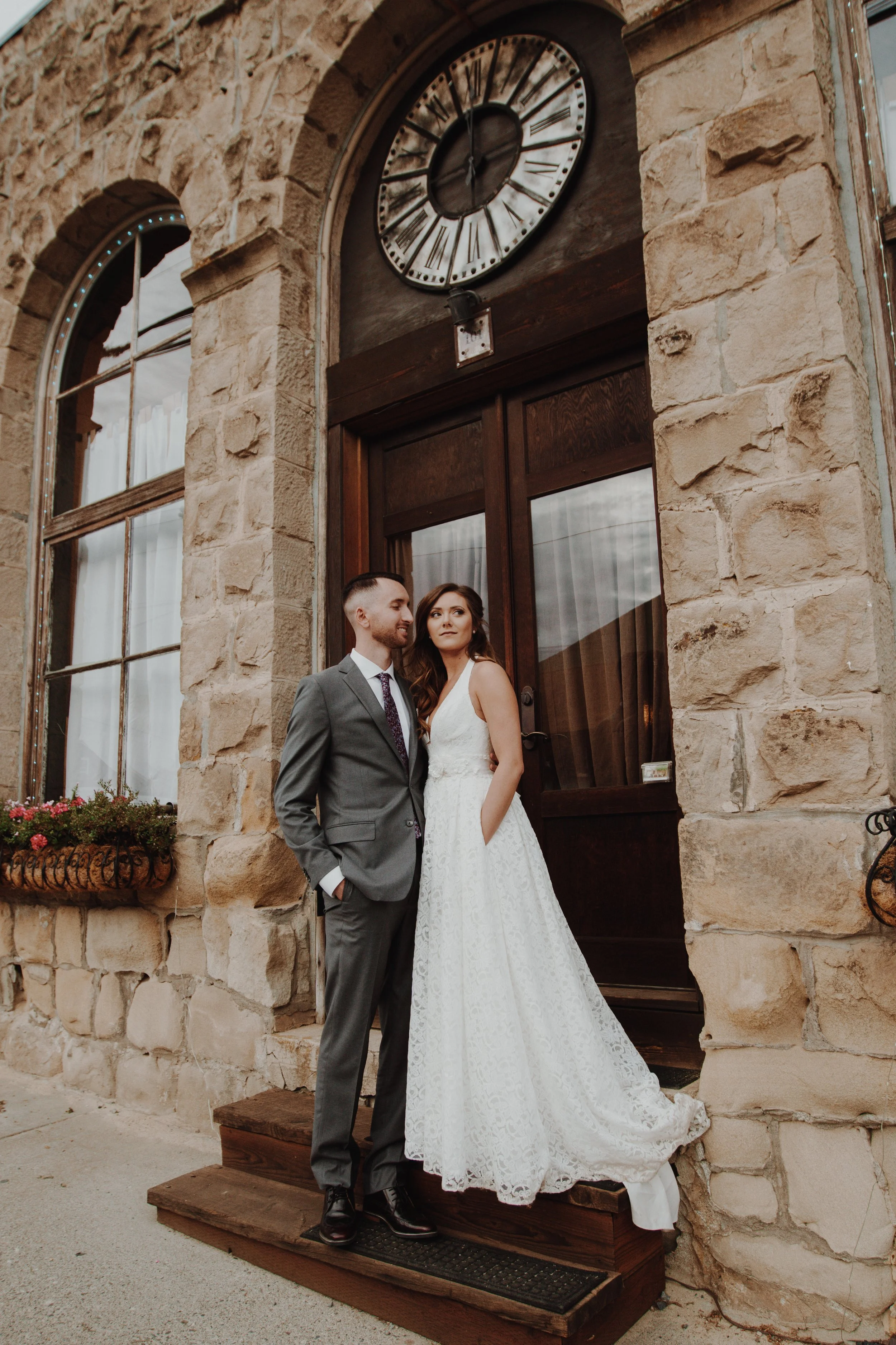 An image of a bride and groom outside of StoneHouse101 Events Venue in Roslyn. StoneHouse101 is an intimate indoor outdoor events venue in Roslyn, Washington, hosting weddings, birthdays, anniversaries, and more near Cle Elum, WA.