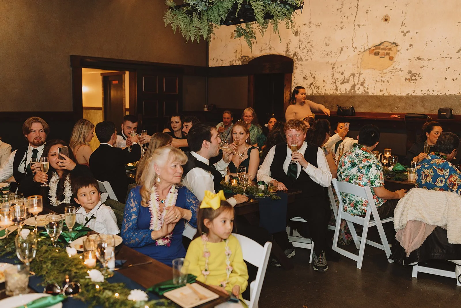 An image of guests enjoying an indoor party at StoneHouse101 near Cle Elum. StoneHouse101 is an intimate indoor outdoor events venue in Roslyn, Washington, hosting weddings, birthdays, anniversaries, and more near Cle Elum, WA.