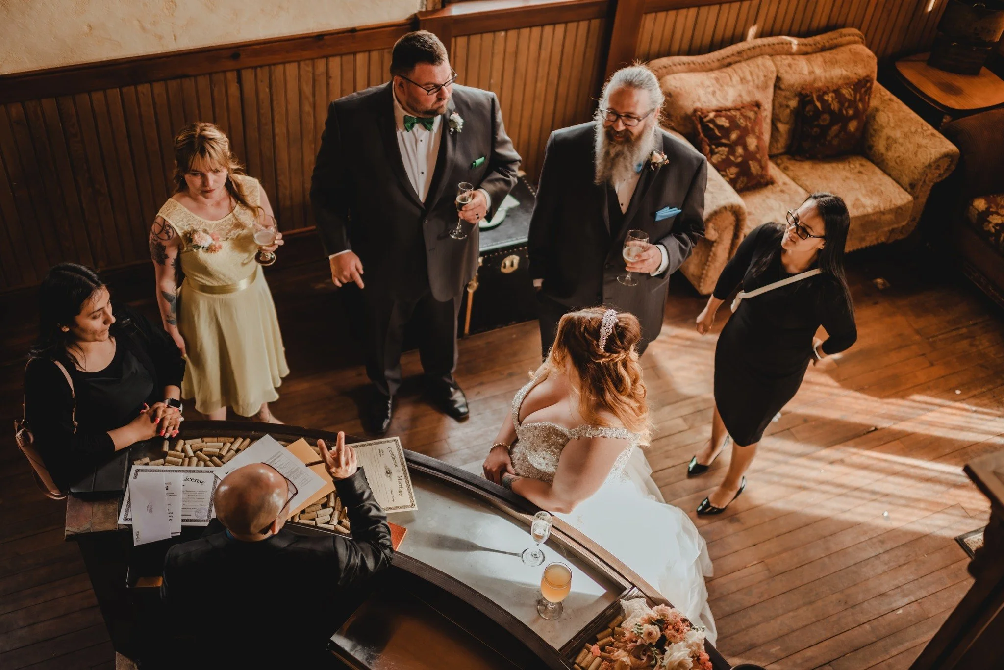 An image of guests socializing inside the historic space at StoneHouse101. StoneHouse101 is an intimate indoor outdoor events venue in Roslyn, Washington, hosting weddings, birthdays, anniversaries, and more near Cle Elum, WA.