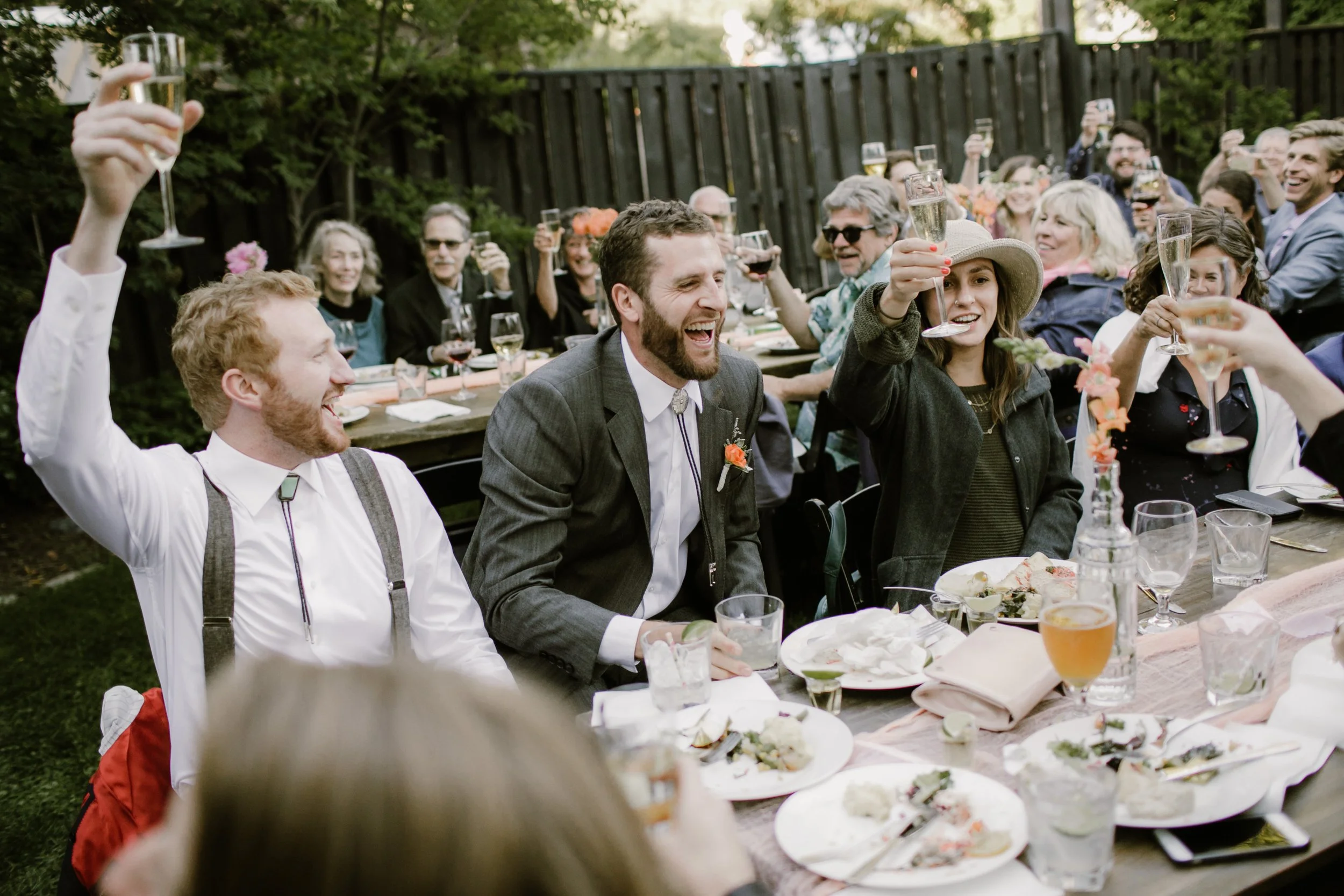 An image of guests enjoying dinner at a StoneHouse101 event. StoneHouse101 is an intimate indoor outdoor events venue in Roslyn, Washington, hosting weddings, birthdays, anniversaries, and more near Cle Elum, WA.