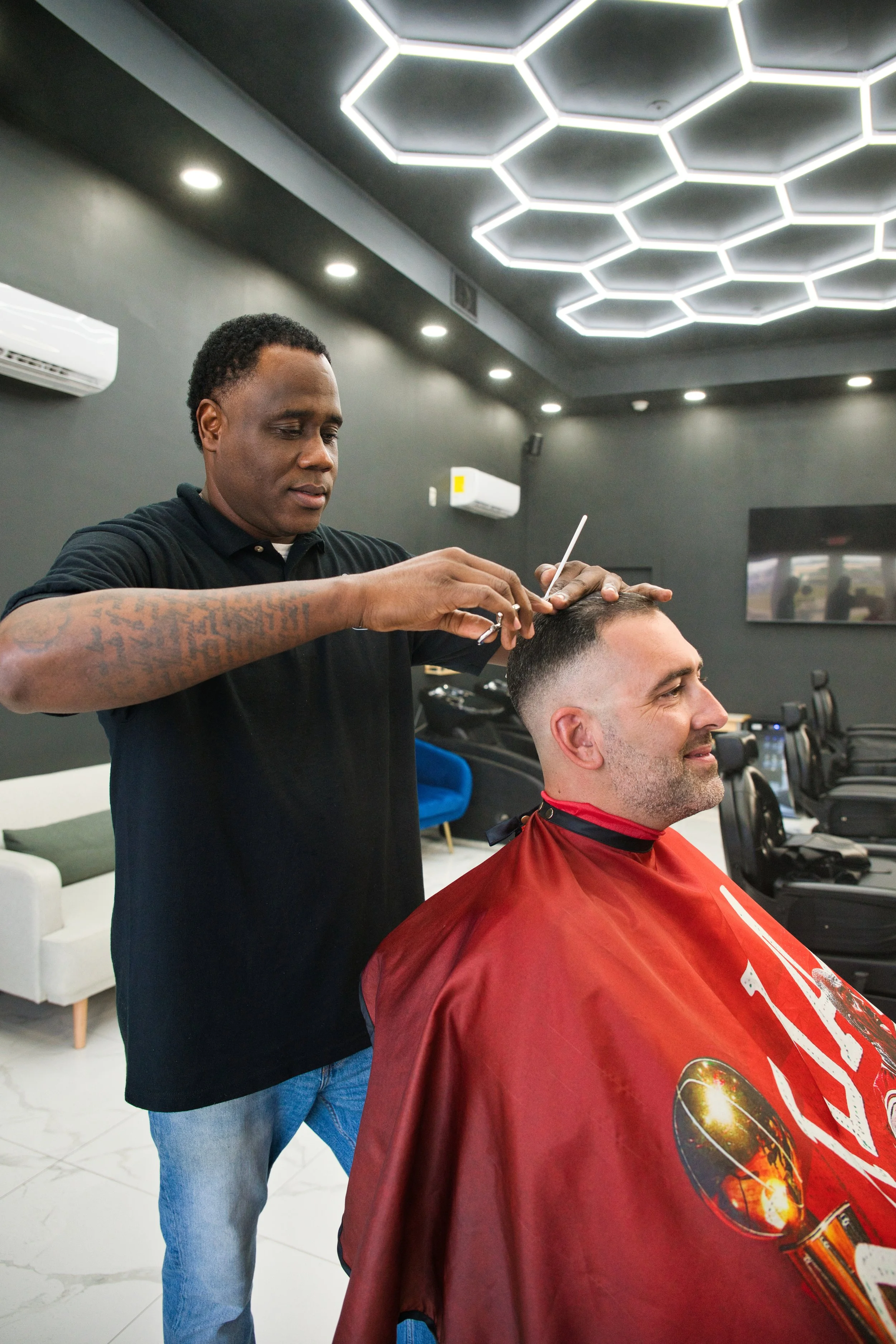 Enjoy ultimate luxury and unmatched service at Platinum Cuts Barbershop with a scissors cut