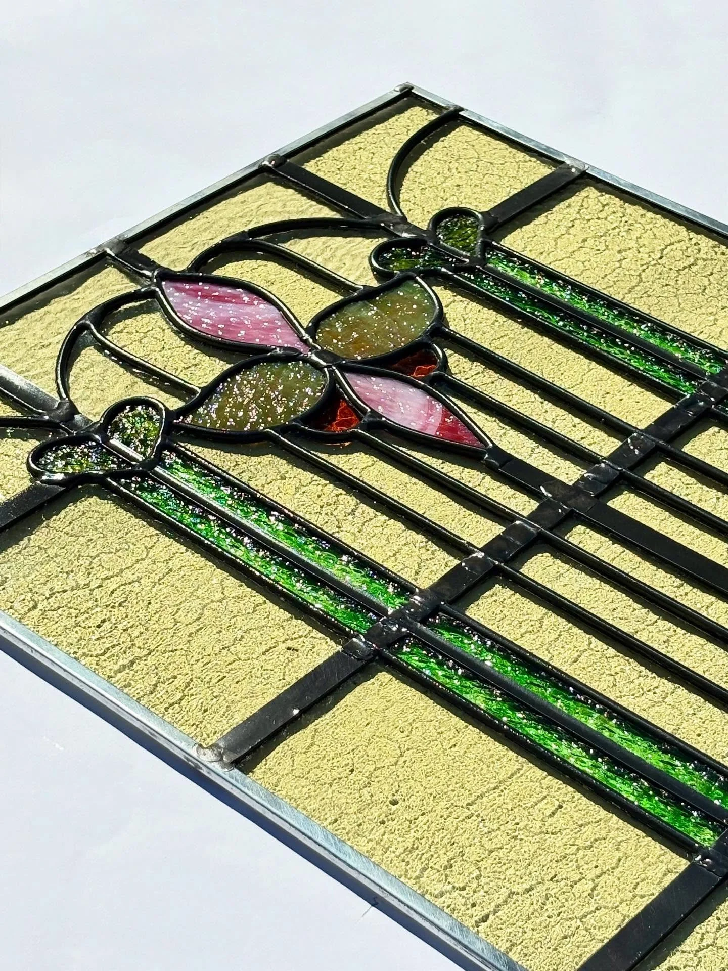 Had the pleasure of restoring this 31x18 window originally made in the 1910&rsquo;s! 

Luckily most of the glass was in great condition, but the window needed an entirely new lead. I took apart the window, threw out the old lead and started from scra