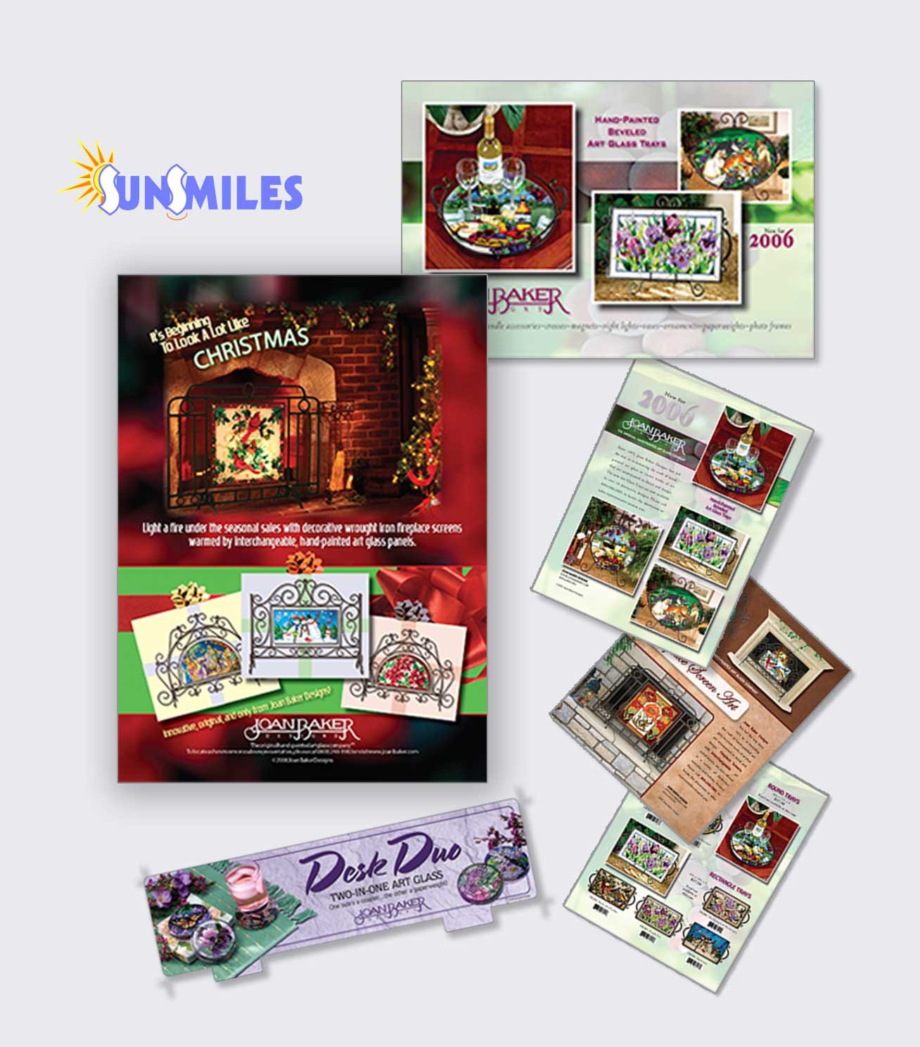 Collection of brochures and flyers showcasing decorative art glass panels with holiday themes, such as Christmas and floral designs, including catalogs for hand-painted and etched pieces by Joan Baker.