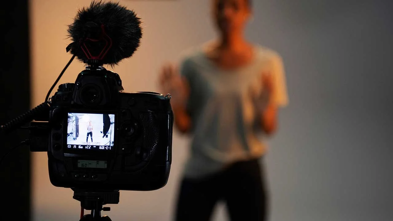 Image of video set with camera and actress