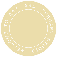 A circular emblem with beige background and white border, featuring the text 'Welcome to Art and Therapy Studio' around the circle's edge.