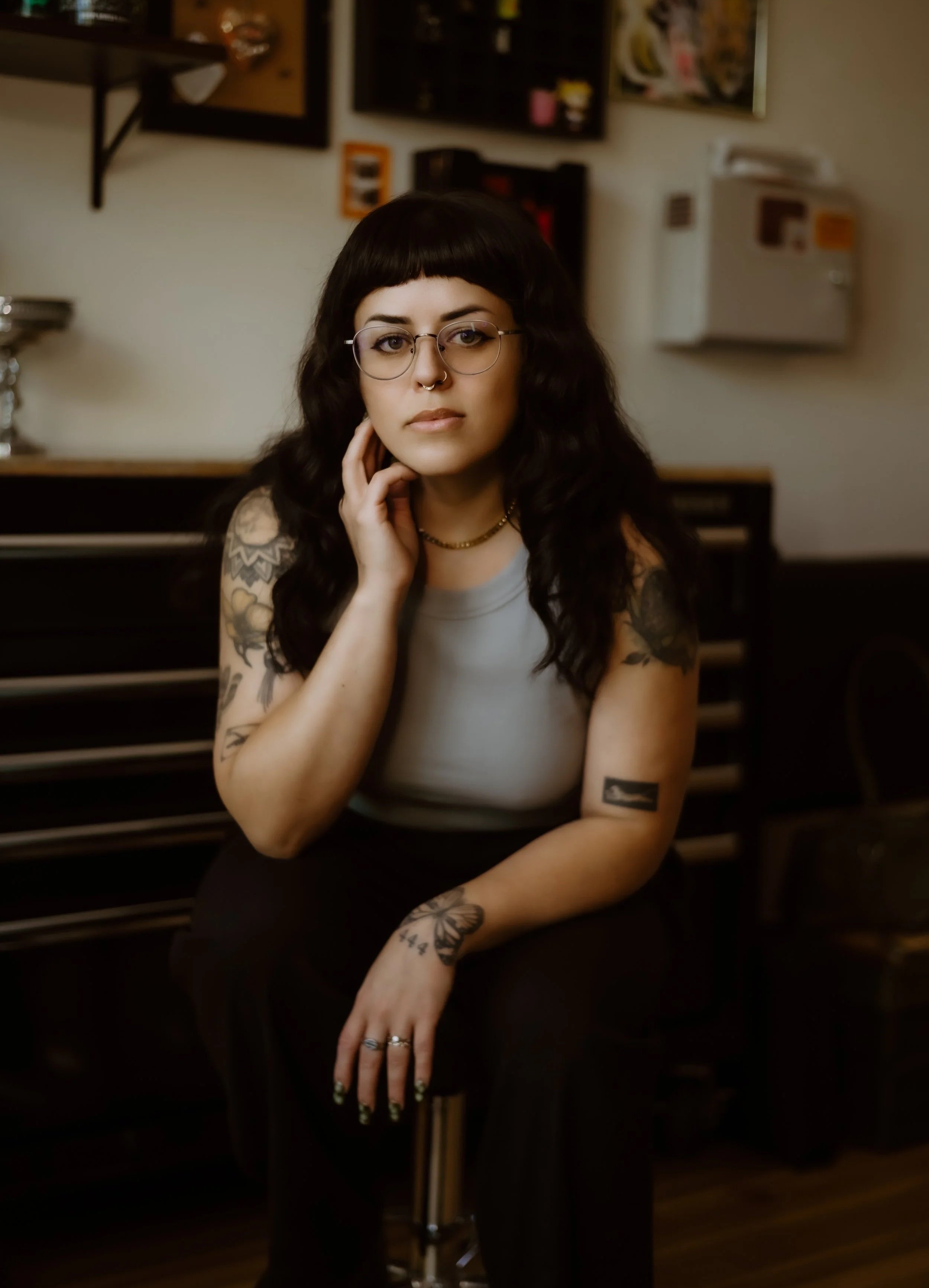Sarah, a fine line black and gray specialist working at blackbird ink tattoo, an all woman tattoo shop in central Colorado