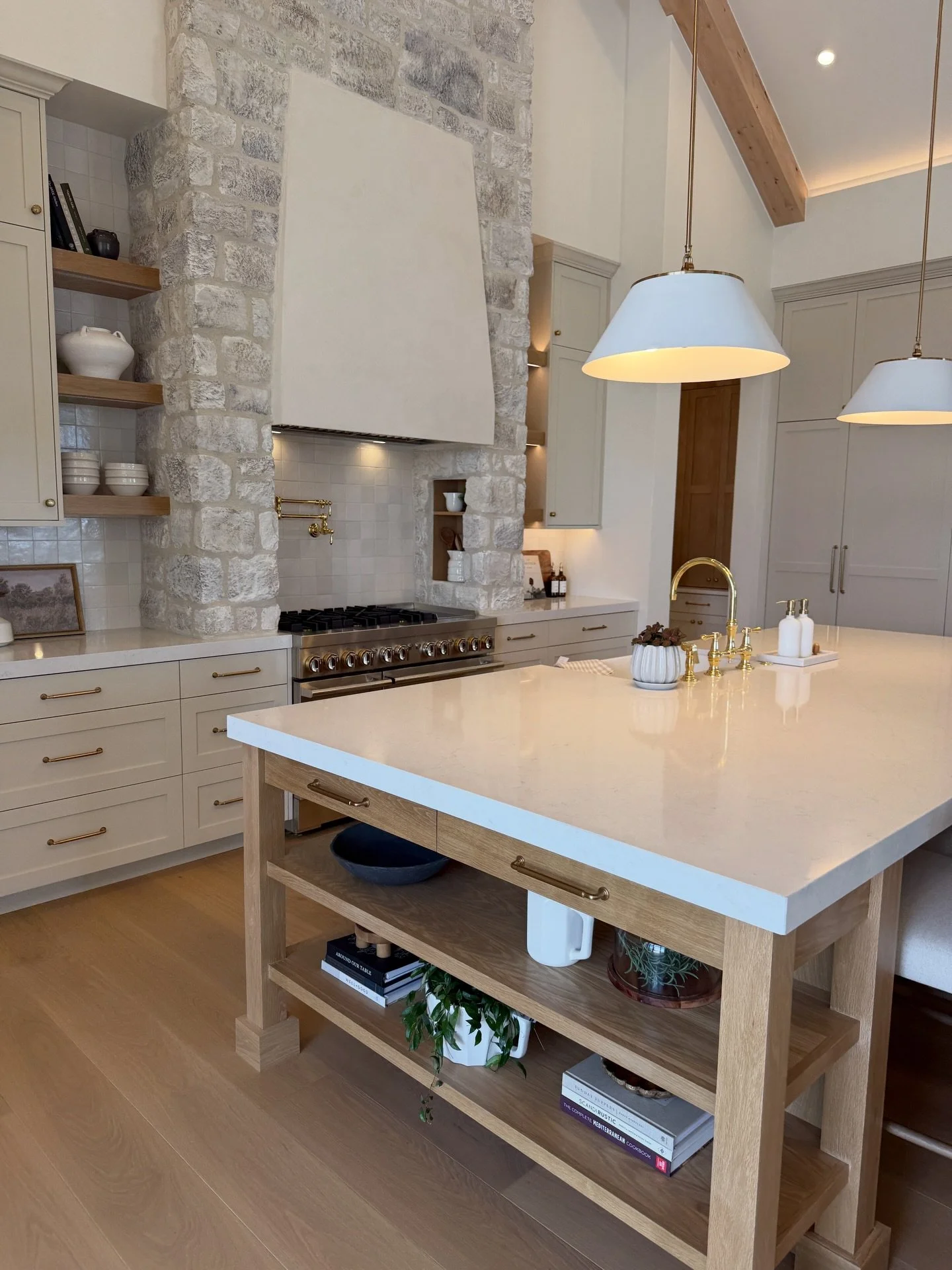 There were so many beautiful spaces in this home. As we&rsquo;re in the middle of our build right now, I found myself revisiting some of the lighting details this week, and I still really love these kitchen island pendants.

The kitchen and great roo